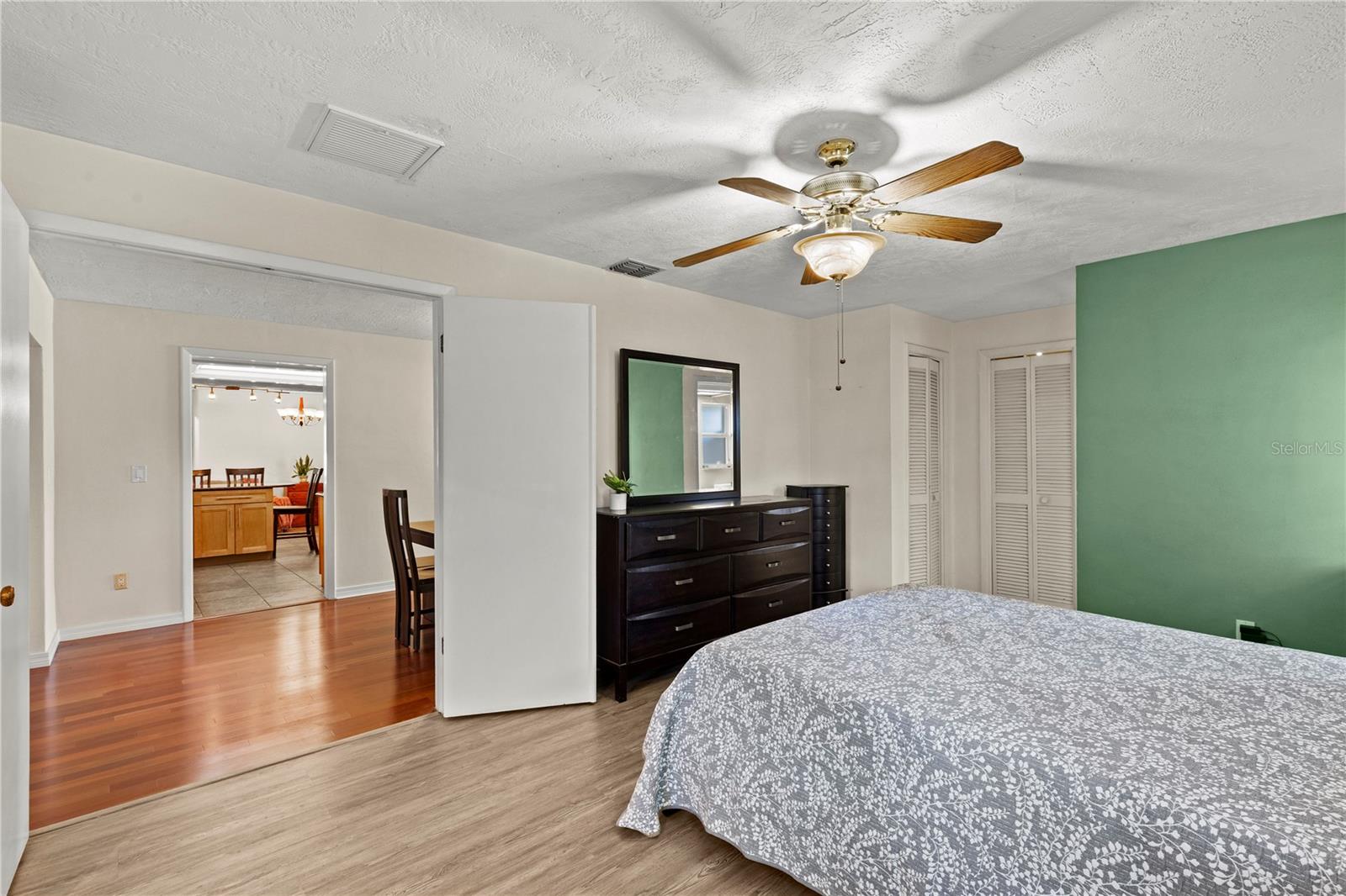 Spacious primary bedroom retreat featuring a bright and airy layout, offering a comfortable and private space to unwind. The room provides ample natural light and a peaceful atmosphere, creating the perfect owner’s suite for rest and relaxation
