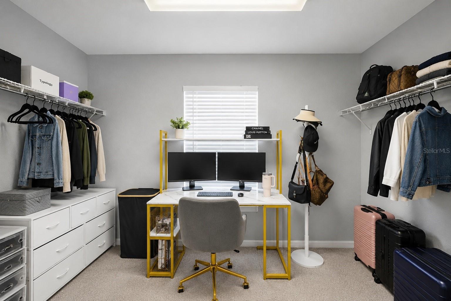 Massive walk in closet (virtually minimized clothes to showcase size).
