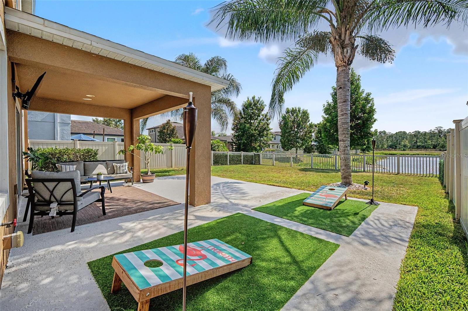 Fenced-in backyard with year 'round water views