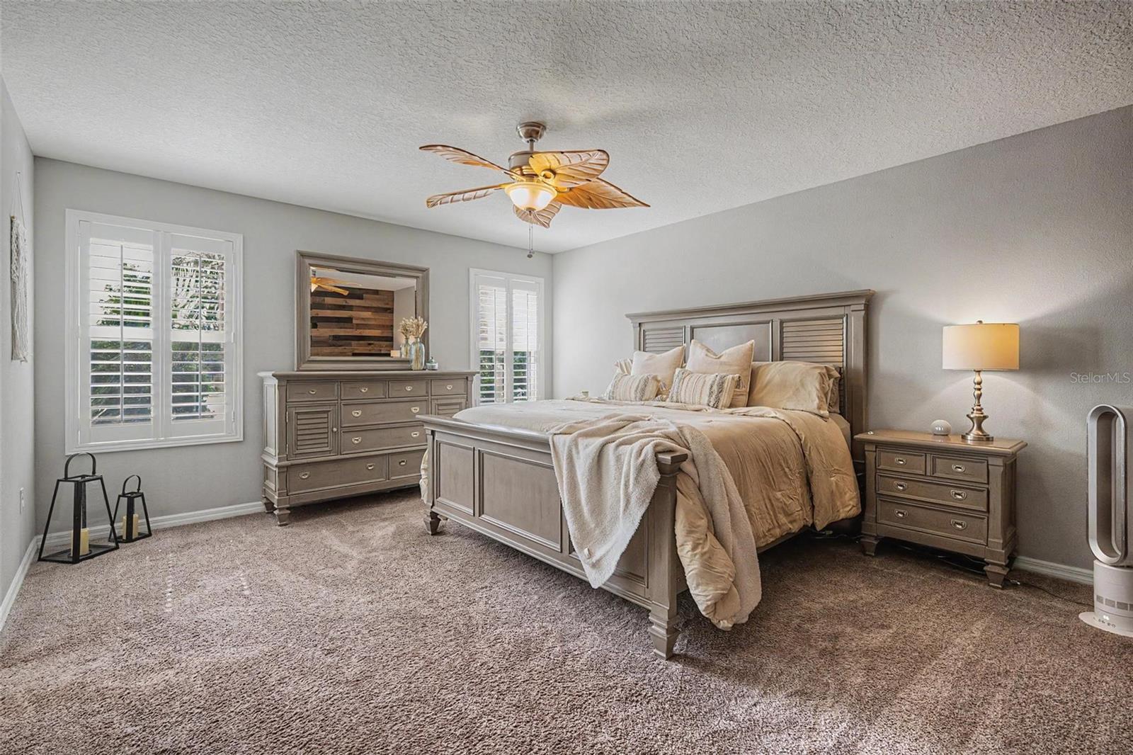 Oversized primary bedroom also with plantation shutters