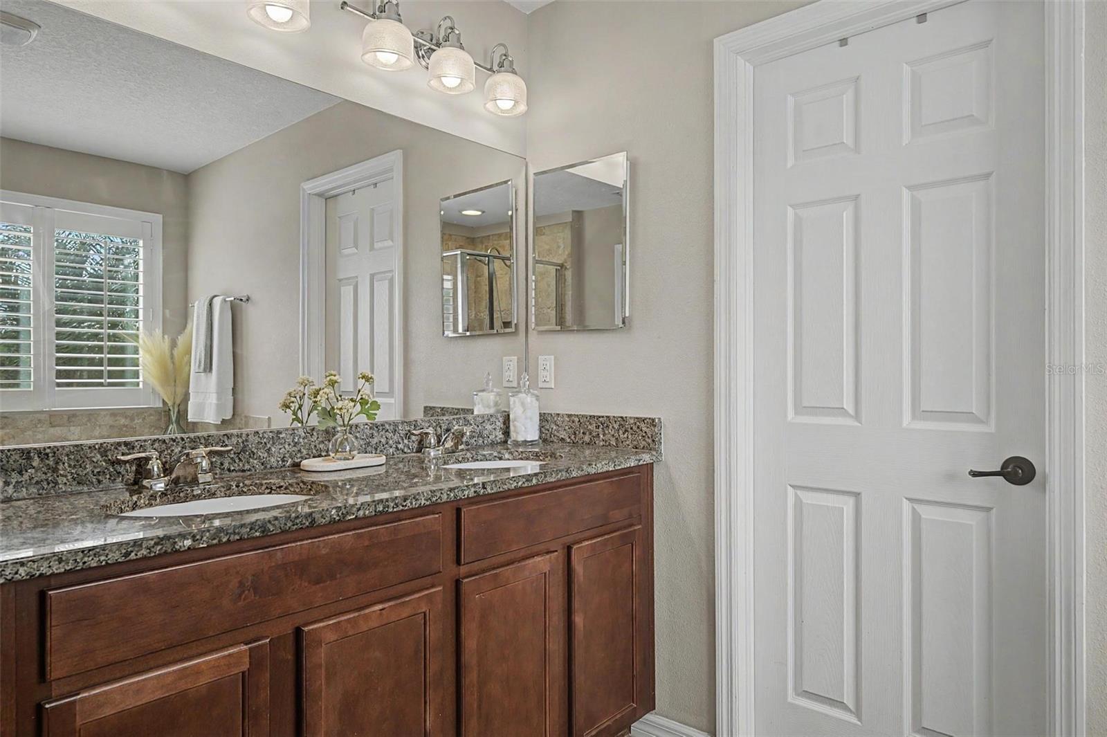 Granite countertops in primary bathroom