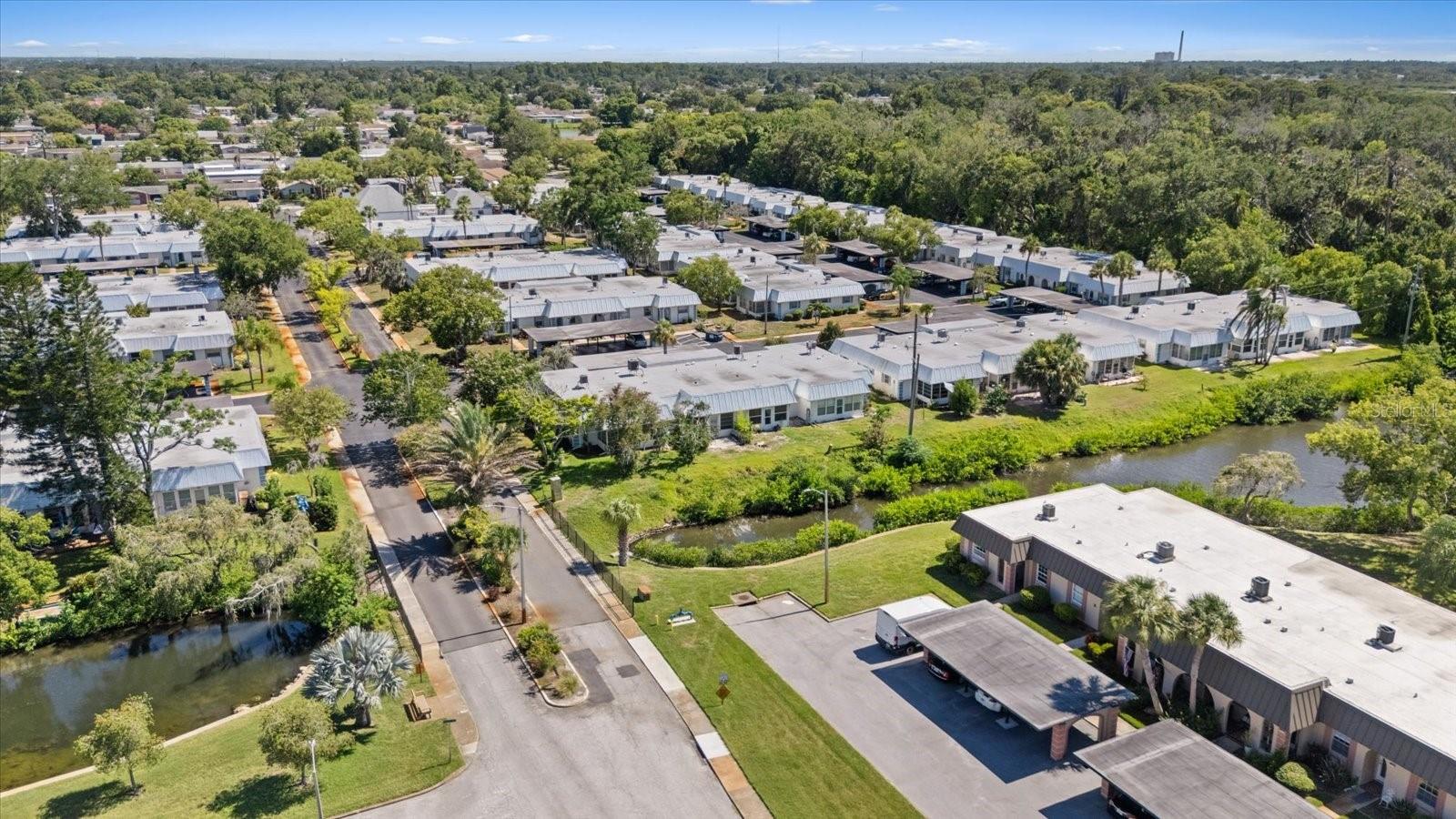 Aerial view of complex with Gulf in the distance.