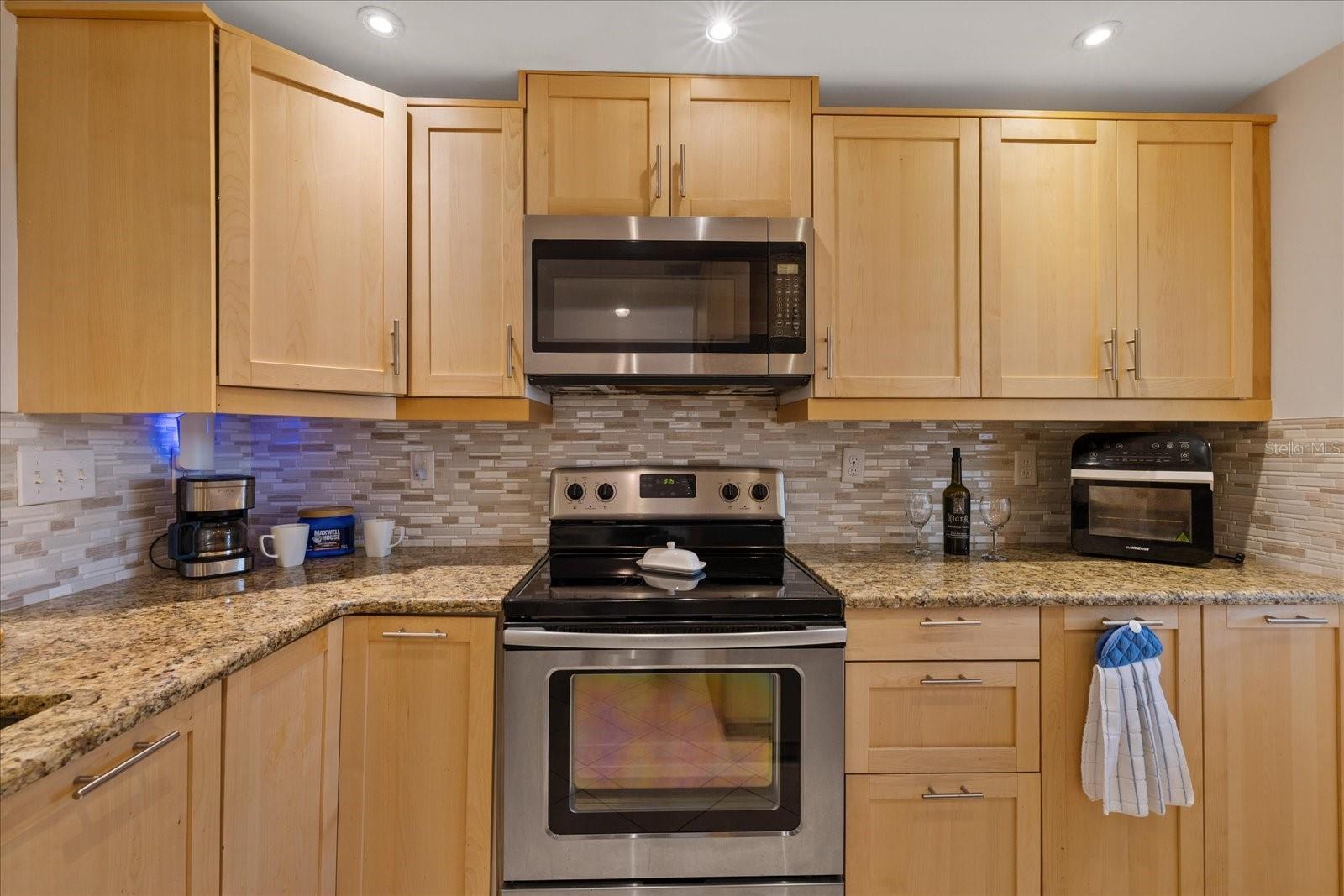 Range and Microwave with lazy susan in corner cabinets