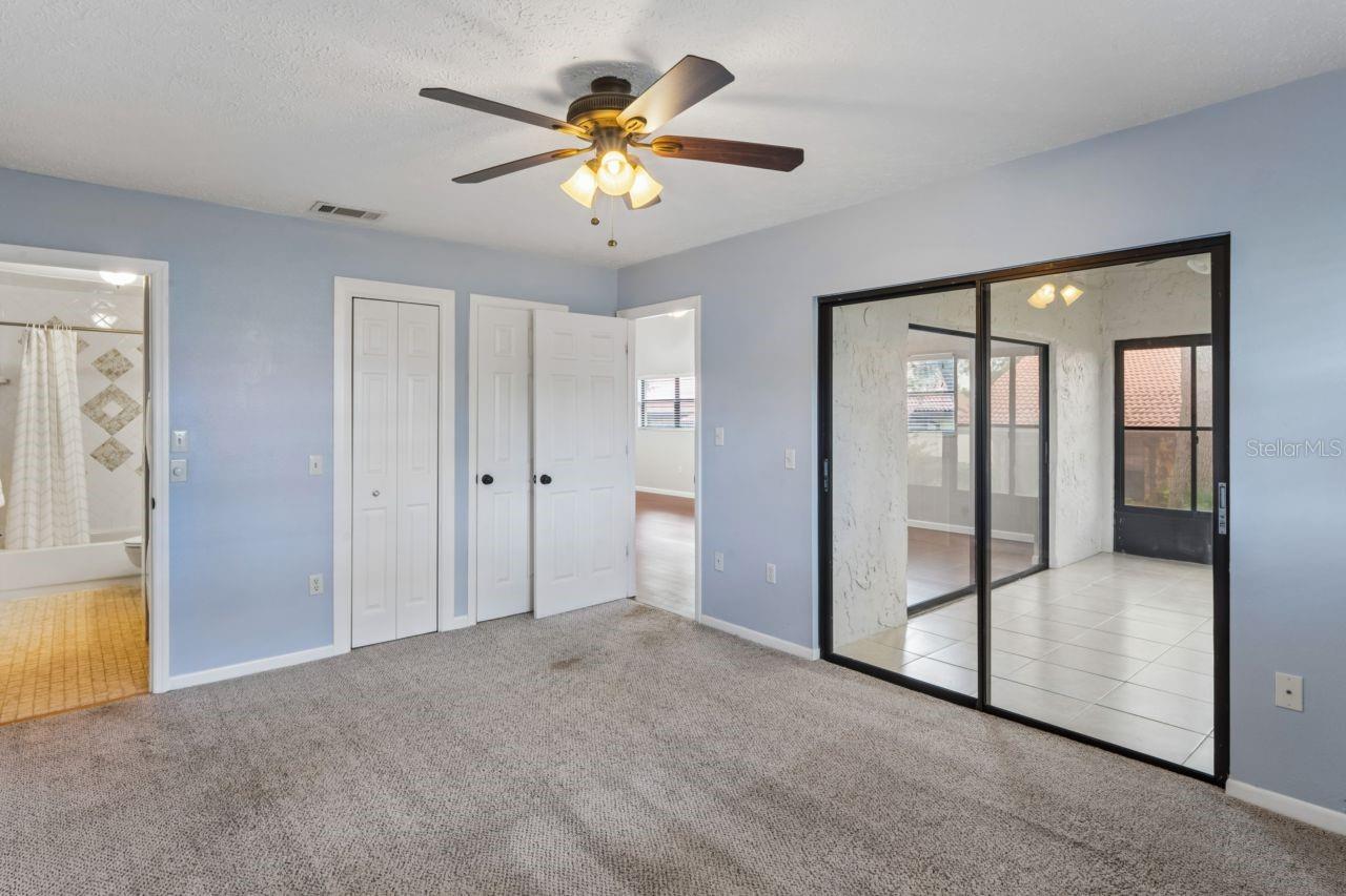 Primary bedroom has a slider leading onto the enclosed lanai.