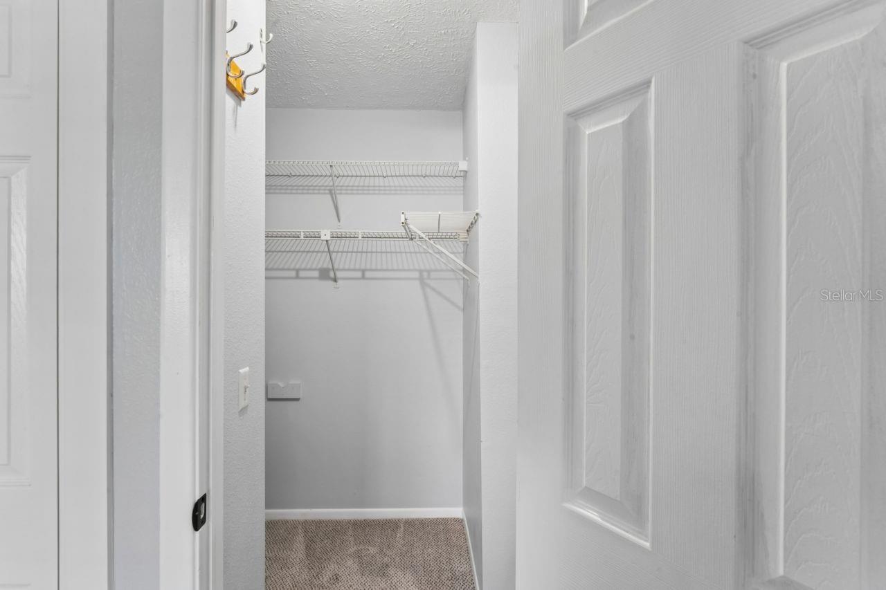 Primary bedroom walk in closet.