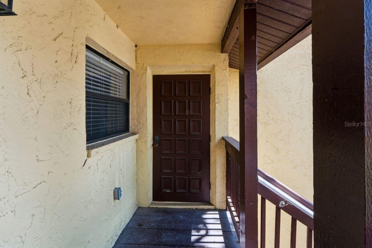 Storage door on the front porch.