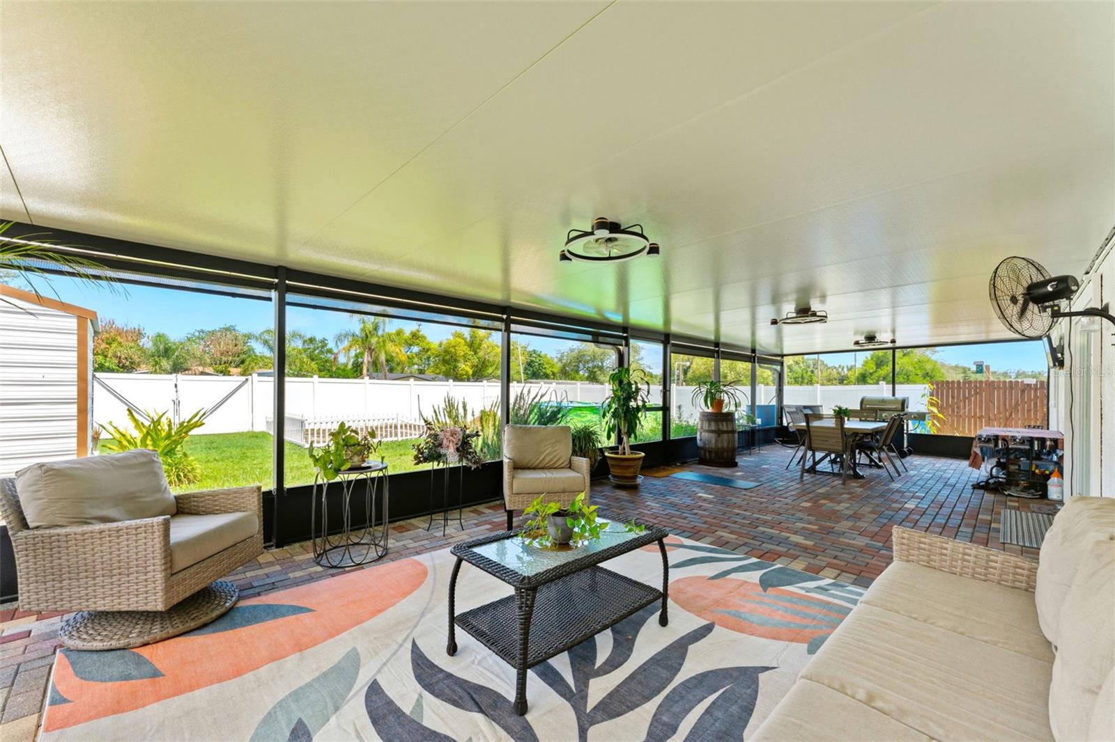 645 SF of Outdoor Living Space - Screened In Patio and Pavers Sealed in 2025, Outdoor Fans 2025, Privacy/Sun Shades 2025