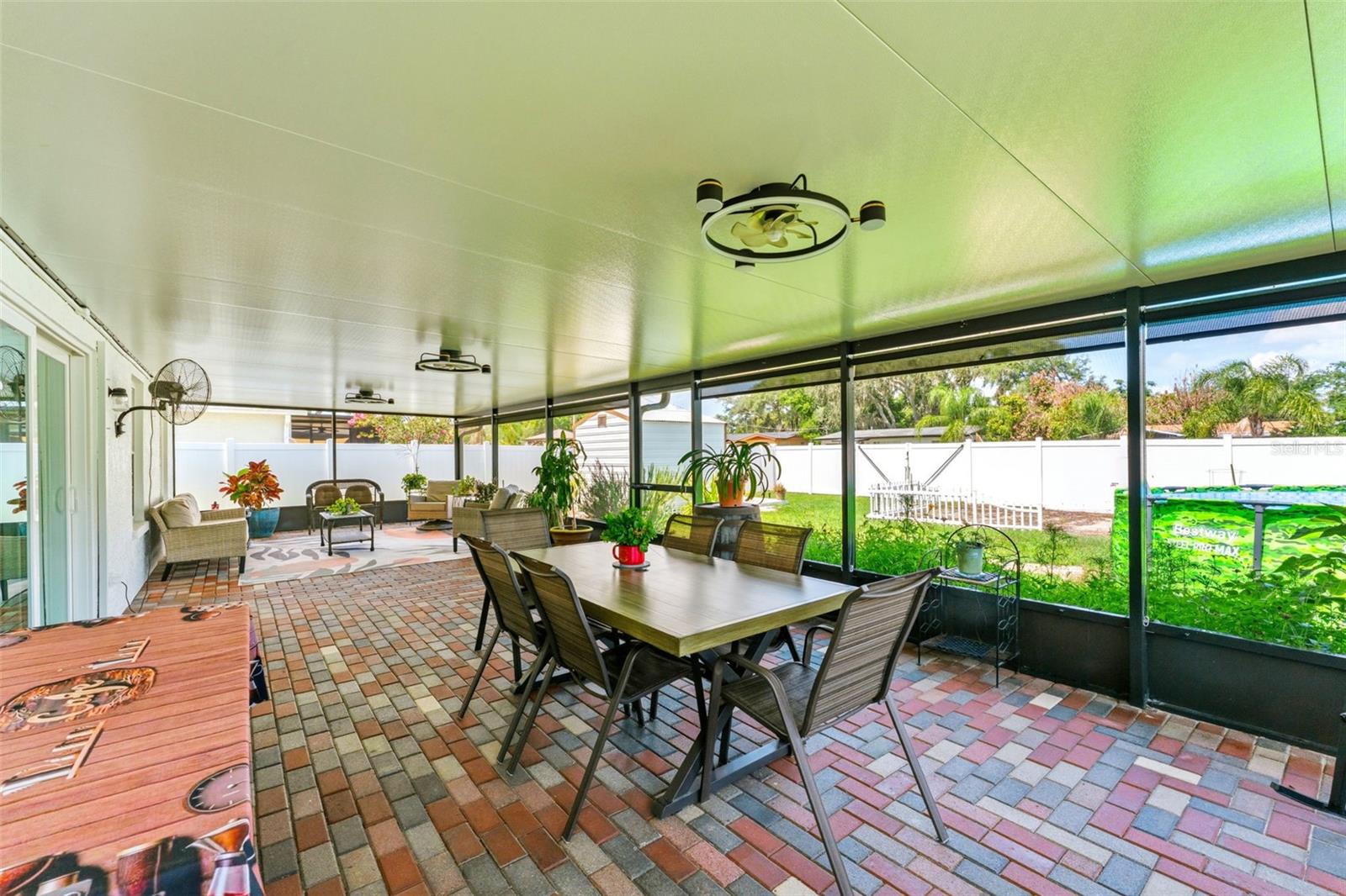 645 SF of Outdoor Living Space - Screened In Patio and Pavers Sealed in 2025, Outdoor Fans 2025, Privacy/Sun Shades 2025