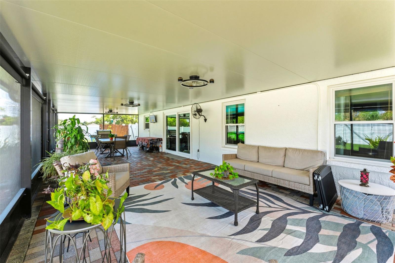 645 SF of Outdoor Living Space - Screened In Patio and Pavers Sealed in 2025, Outdoor Fans 2025, Privacy/Sun Shades 2025