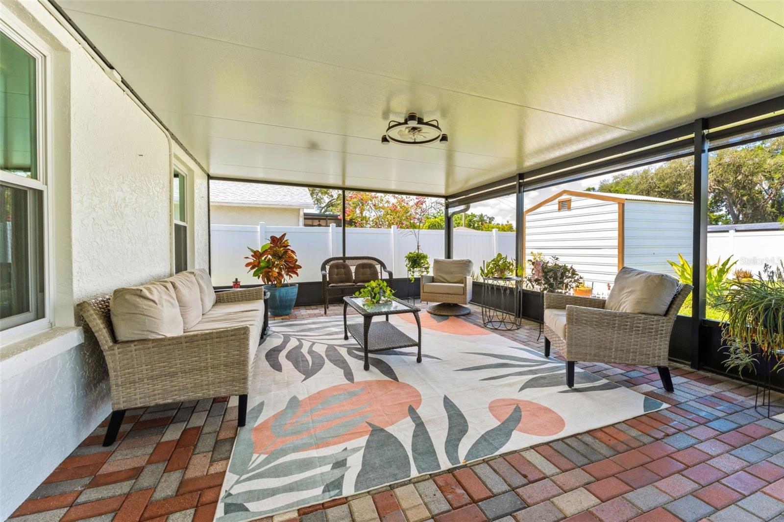 645 SF of Outdoor Living Space - Screened In Patio and Pavers Sealed in 2025, Outdoor Fans 2025, Privacy/Sun Shades 2025