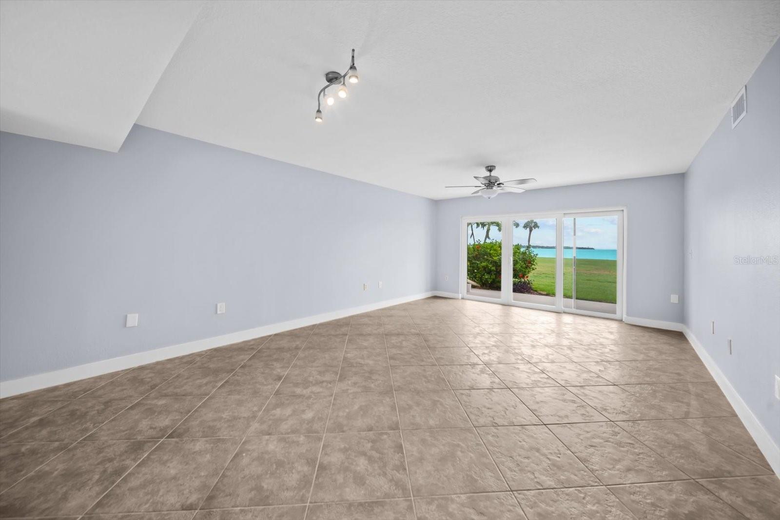 large open concept living area with views of the landscape and the Tampa Bay Water