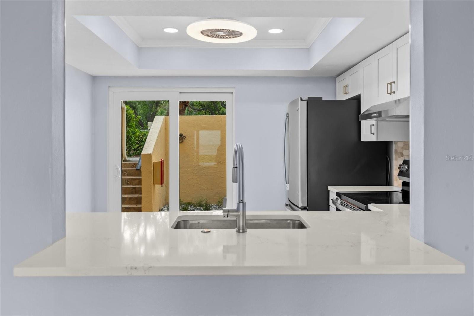 Sliders off the kitchen to your private front patio