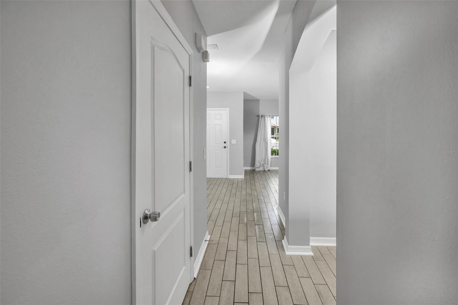 Front entrance with 1/2 bathroom door