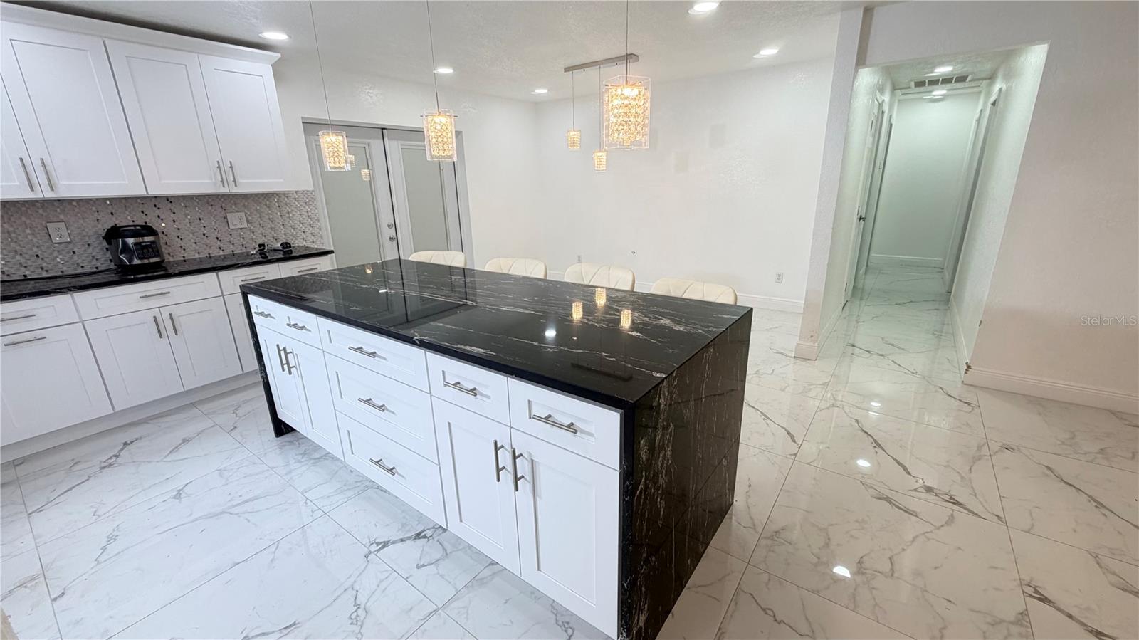 Hall, dining room and kitchen island