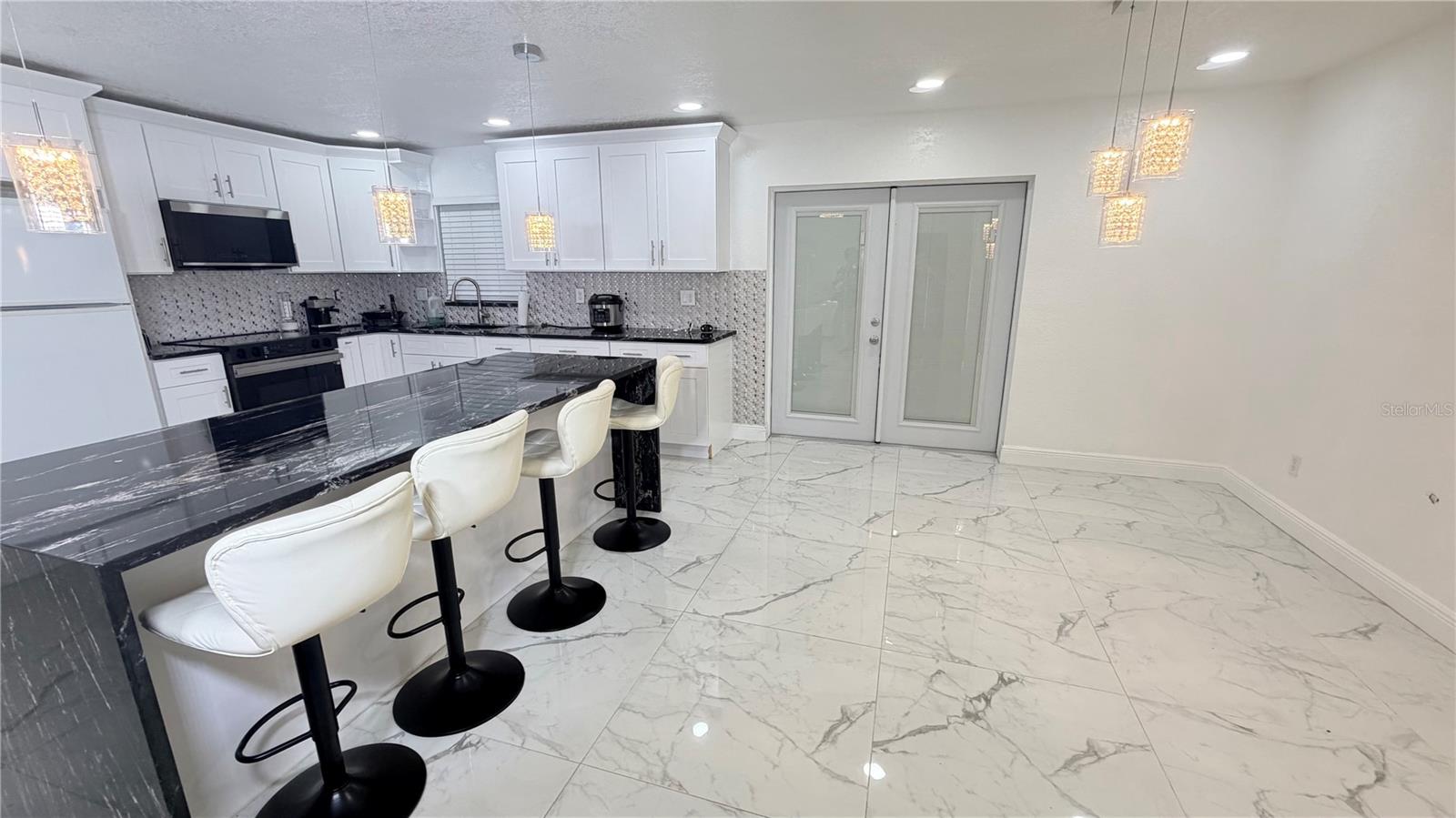 Formal dining room and kitchen view