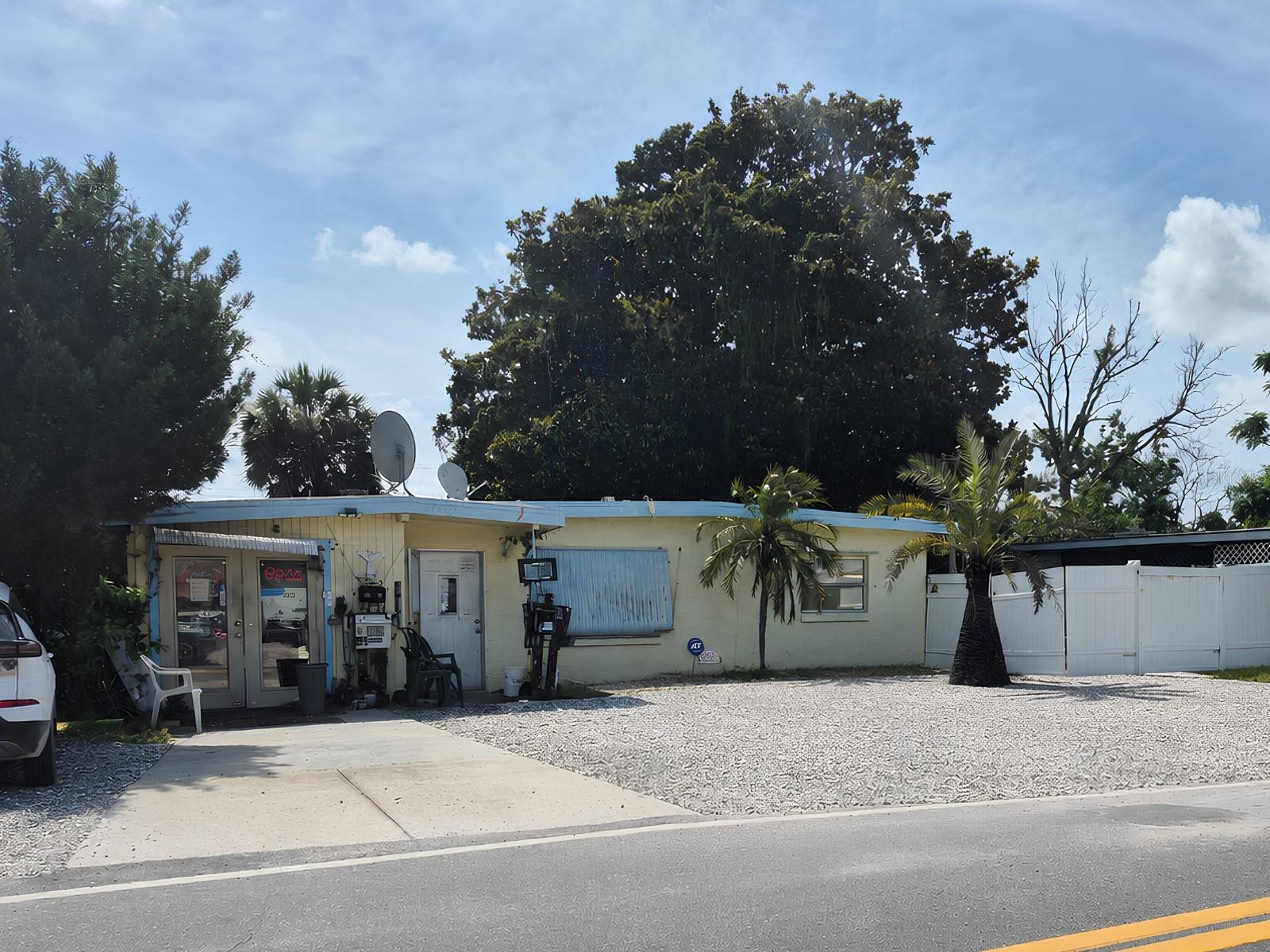 Front of store and of house facing Flamingo Drive.