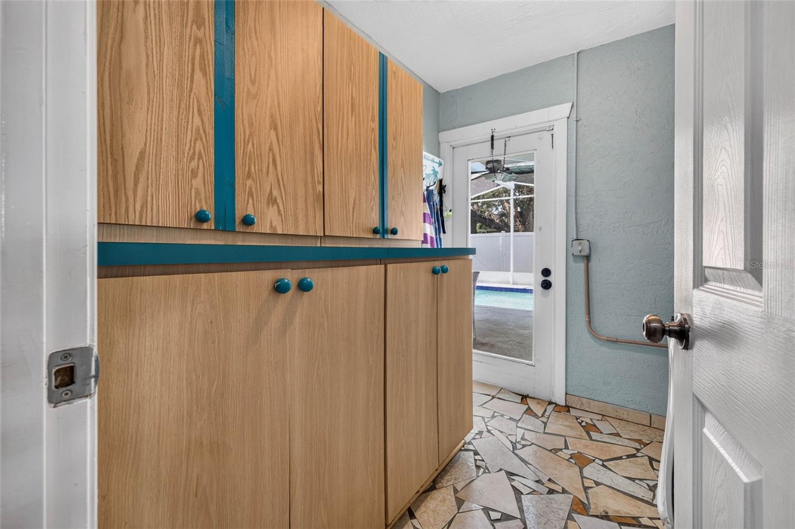 Spacious laundry room with pool access
