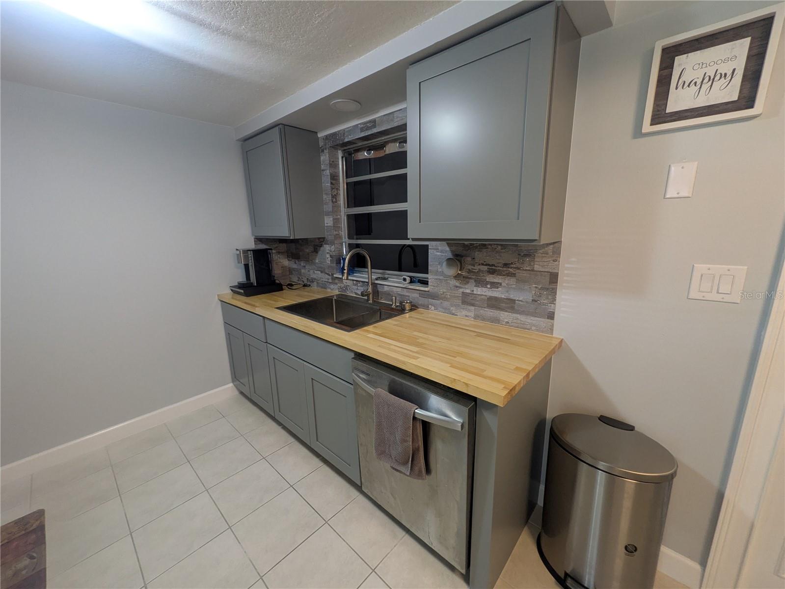 Stainless Steel Sink and butcher block countertops!
