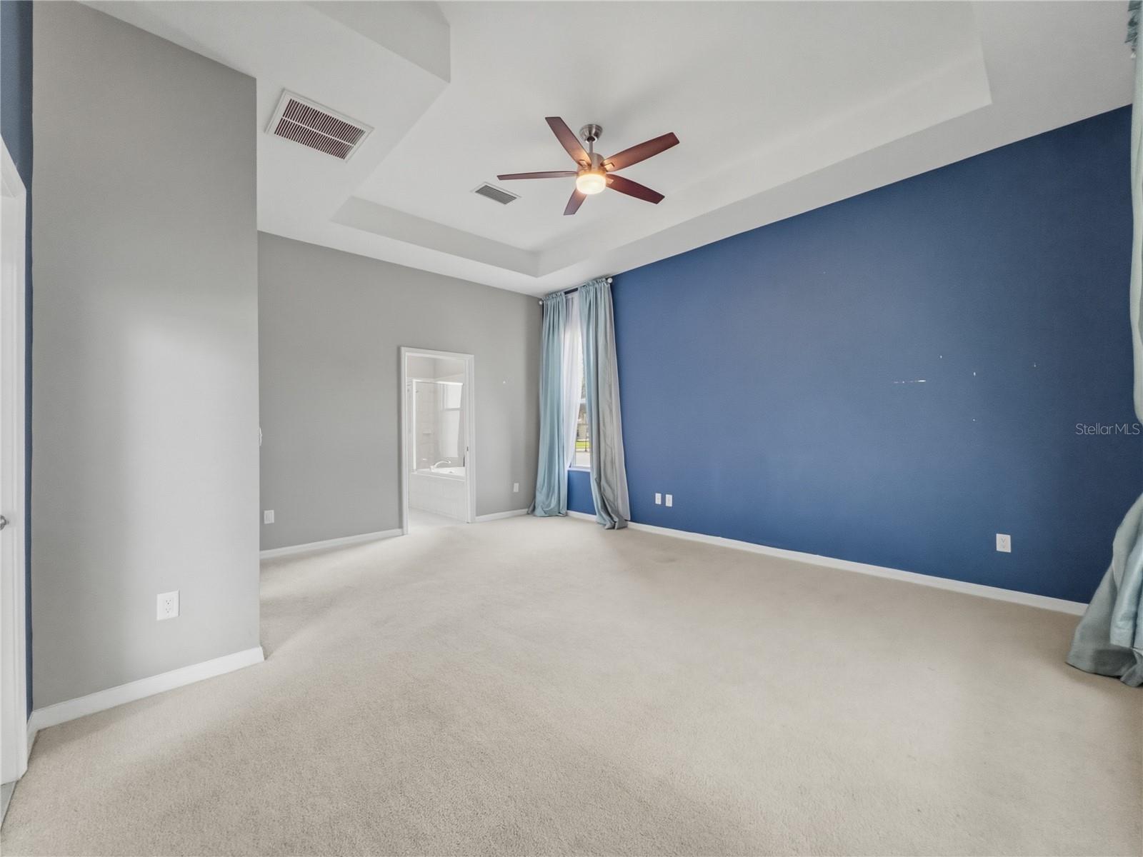 Primary Bedroom toward ensuite - 11530 Oyster Bay Circle, New Port Richey, FL 34654