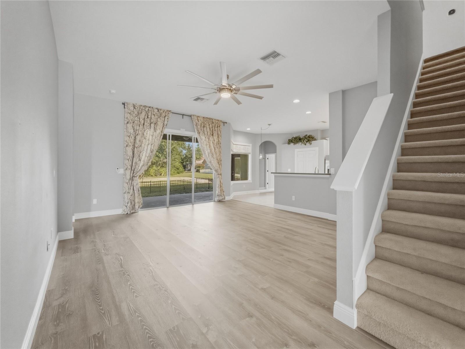 Family Room + Stairs - 11530 Oyster Bay Circle, New Port Richey, FL 34654