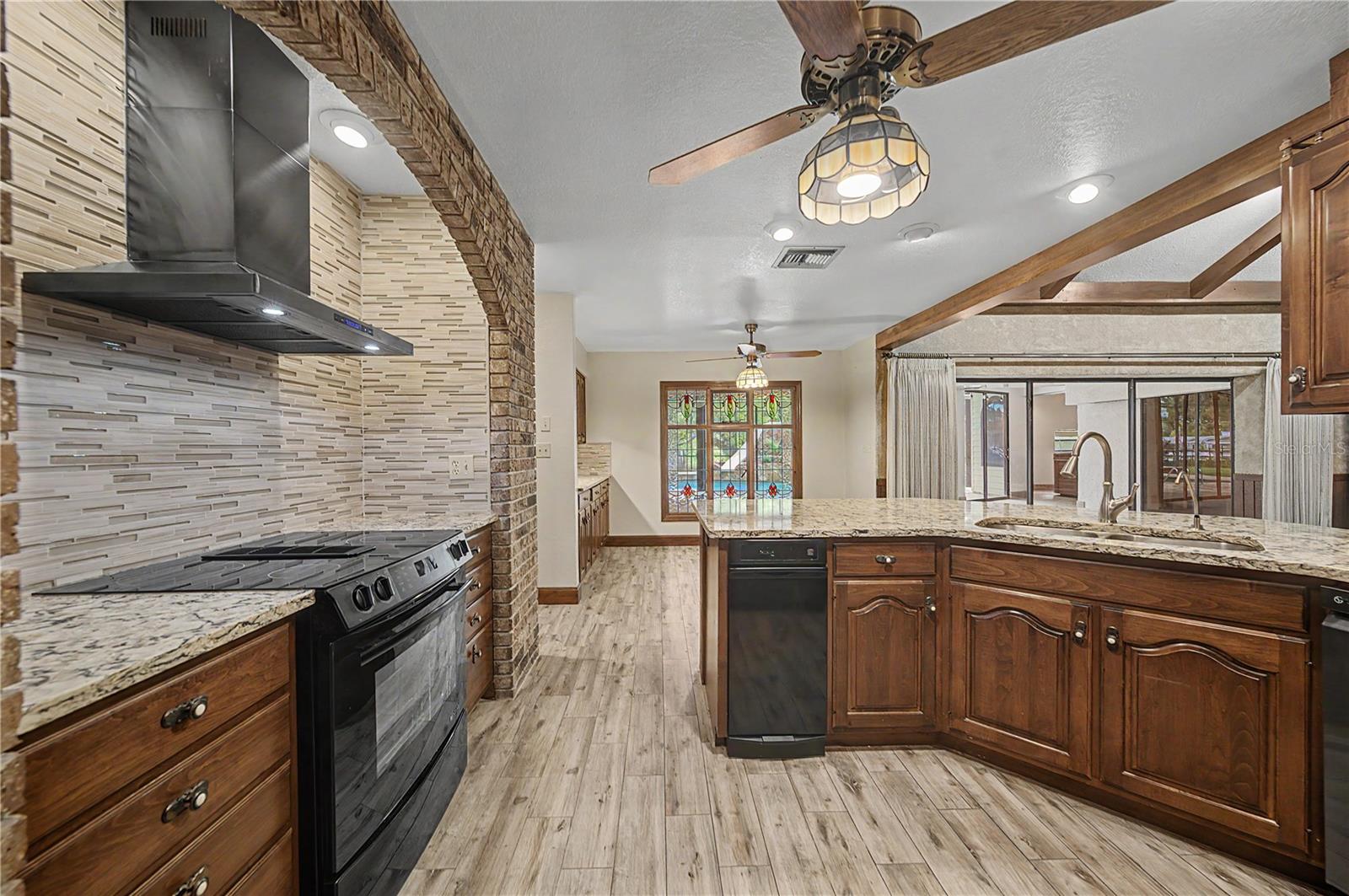 Kitchen features Breakfast bar seating and granite countertops