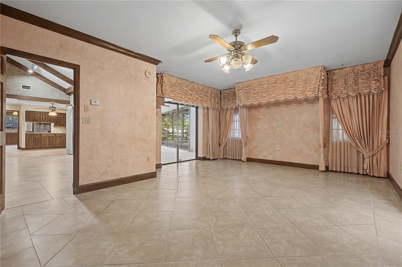 Virtually Staged. Master suite with slider to Enclosed patio