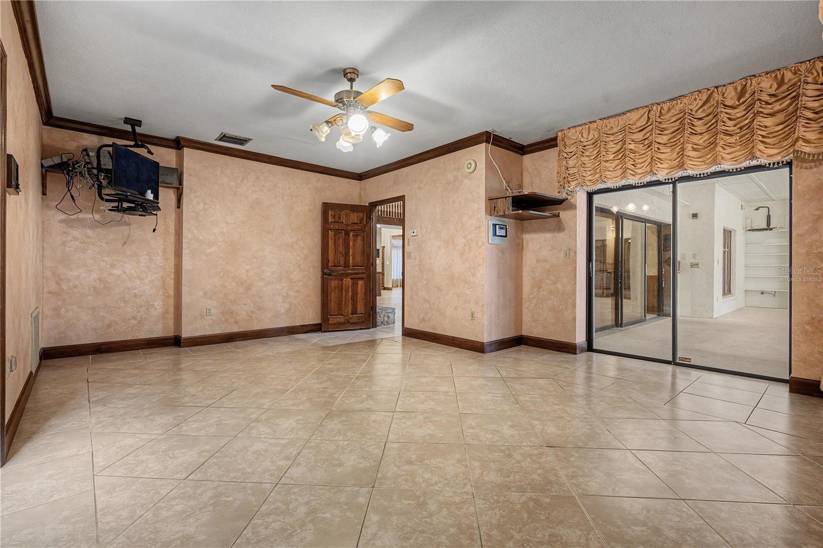 Virtually Staged. Master suite with slider to Enclosed patio