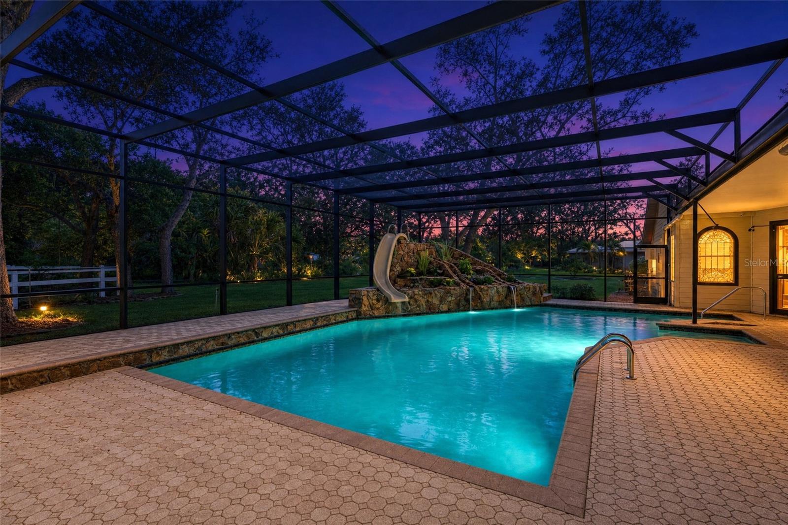 Sparkling Pool with slide, waterfall and screen.