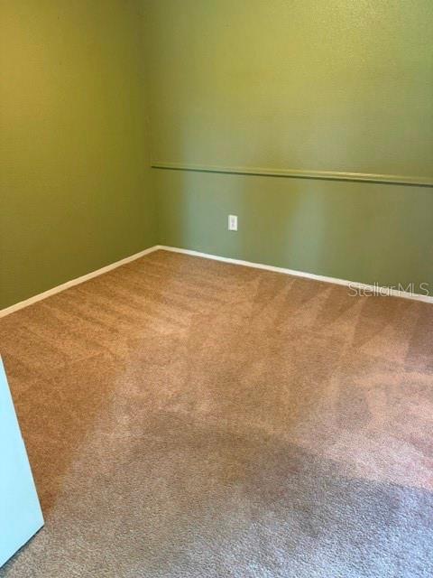 Dining area/carpet is a light tan/strange lighting