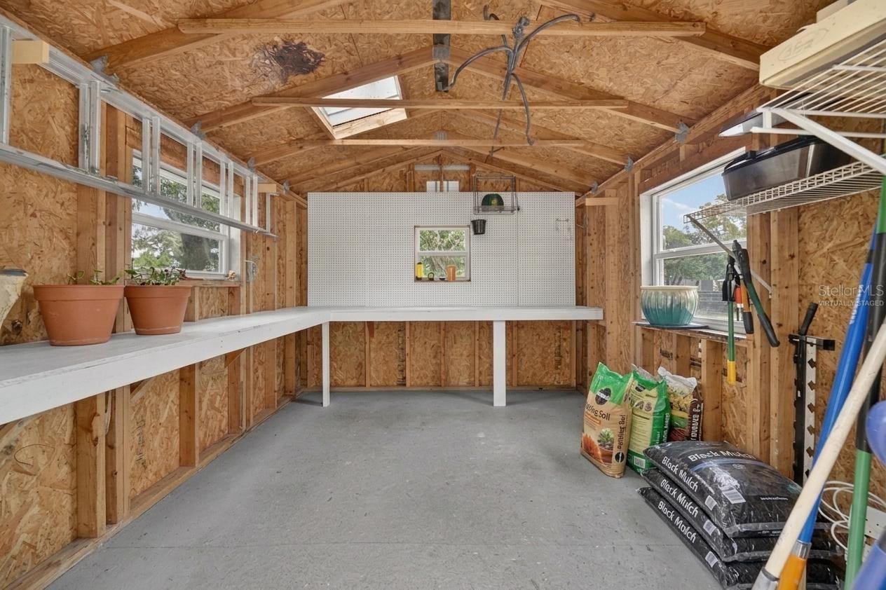 *Virtually Staged Empty* Interior of shed.