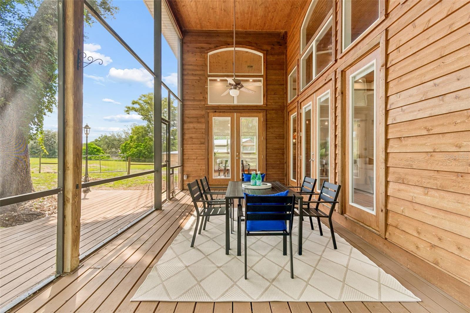 Screened in side and rear wrap around porch