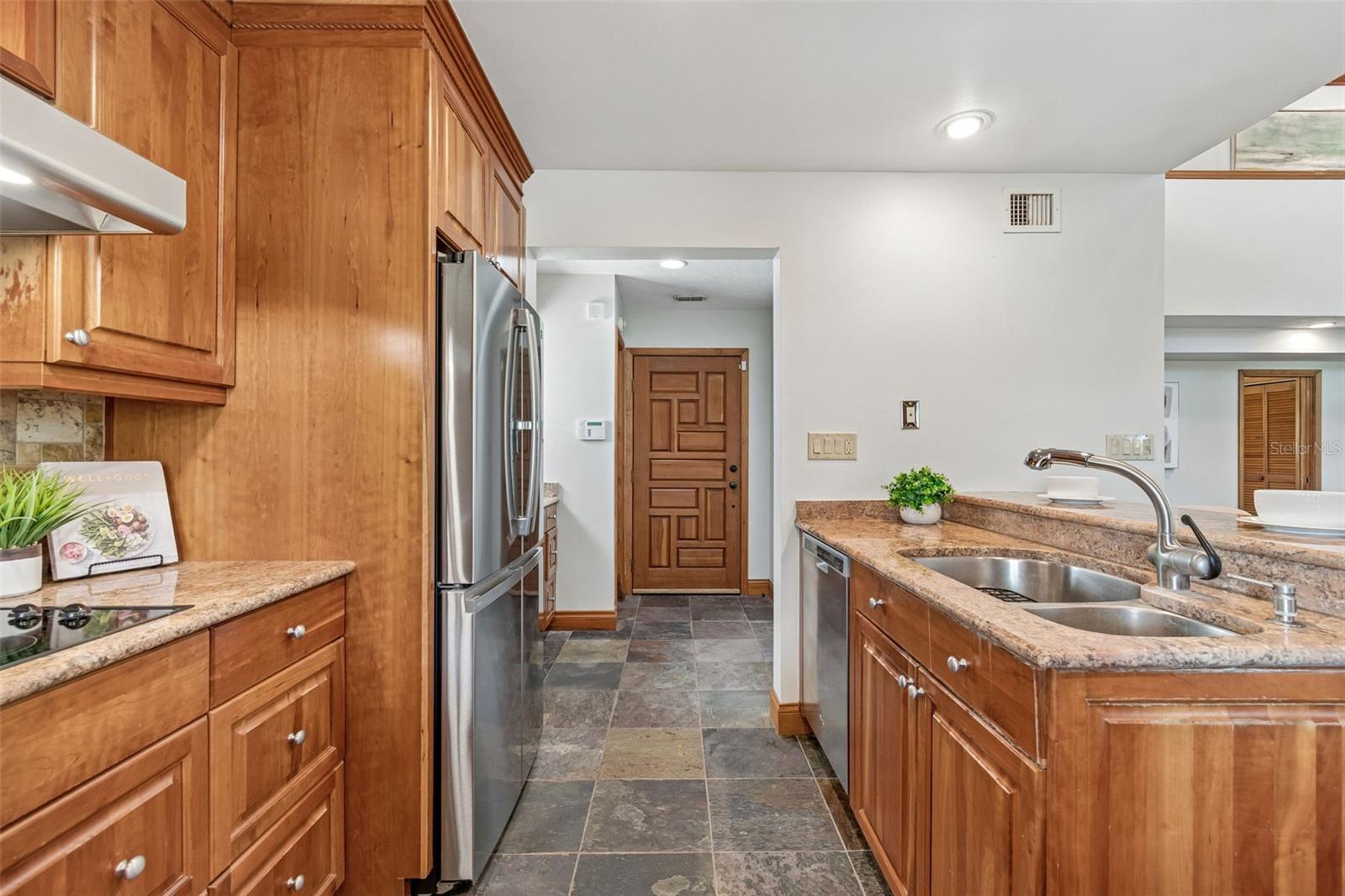 Kitchen with solid wood cabinets and granite counter tops
