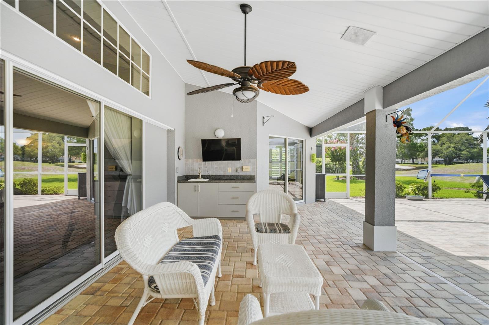 Covered patio screened in pool area