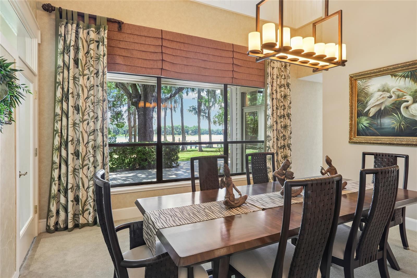Formal dining enjoys backyard lake views
