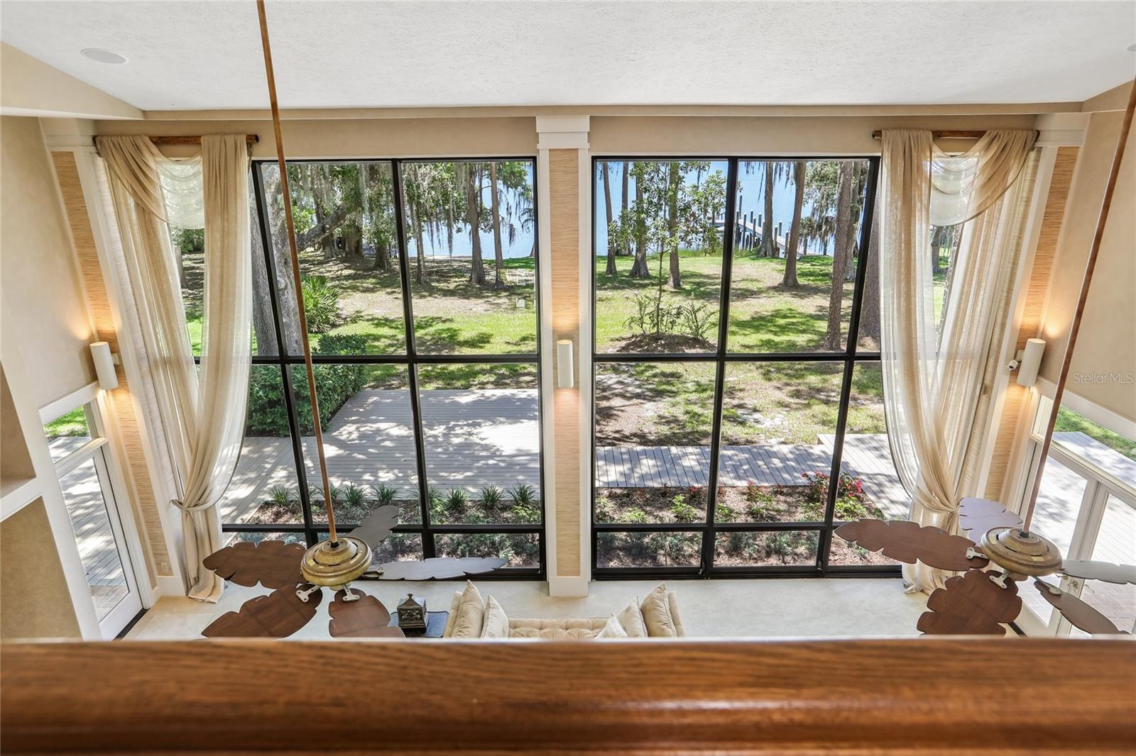 Primary suite balcony over-looks great room