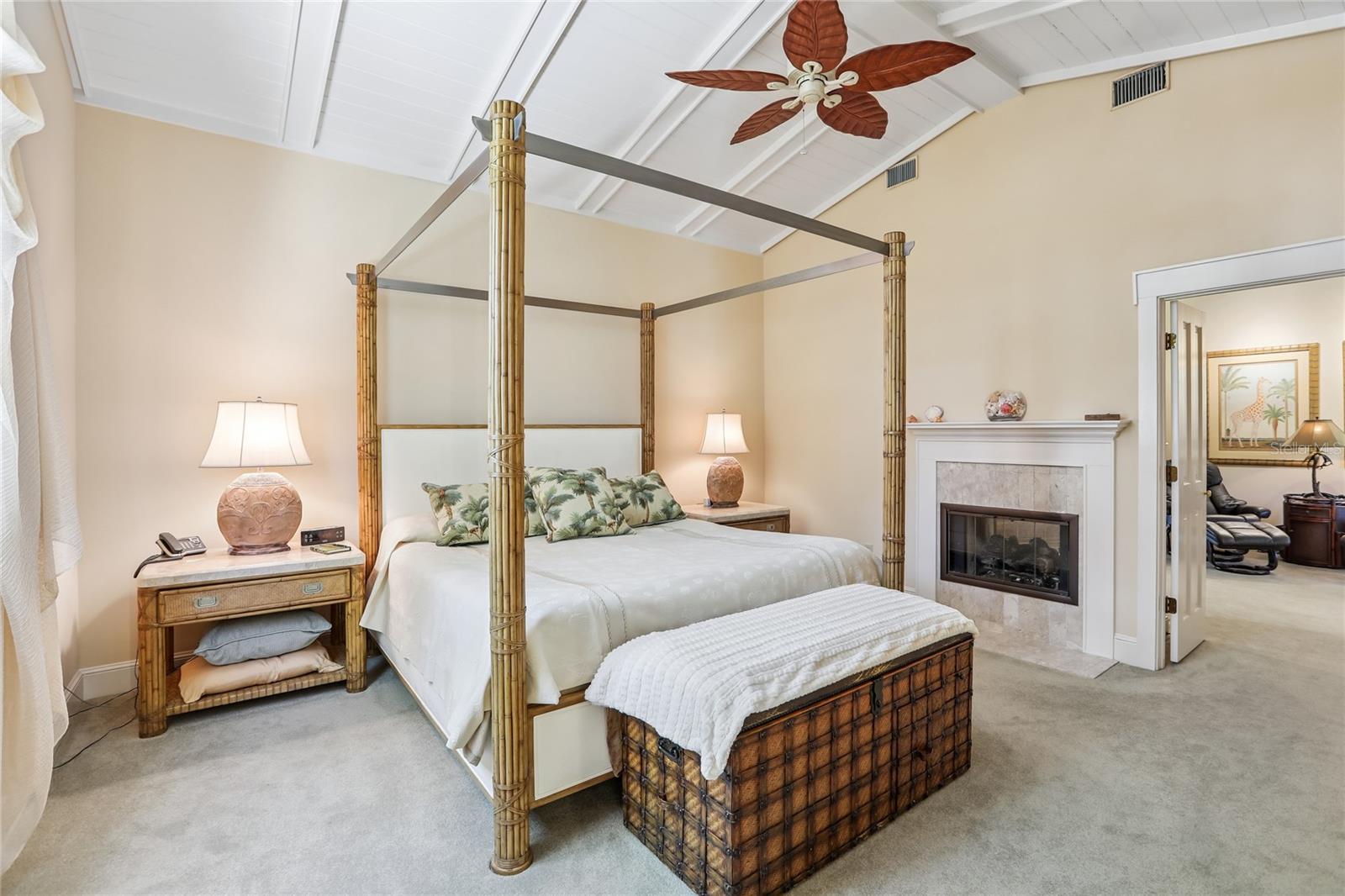 Primary bedroom w/ double sided gas fireplace