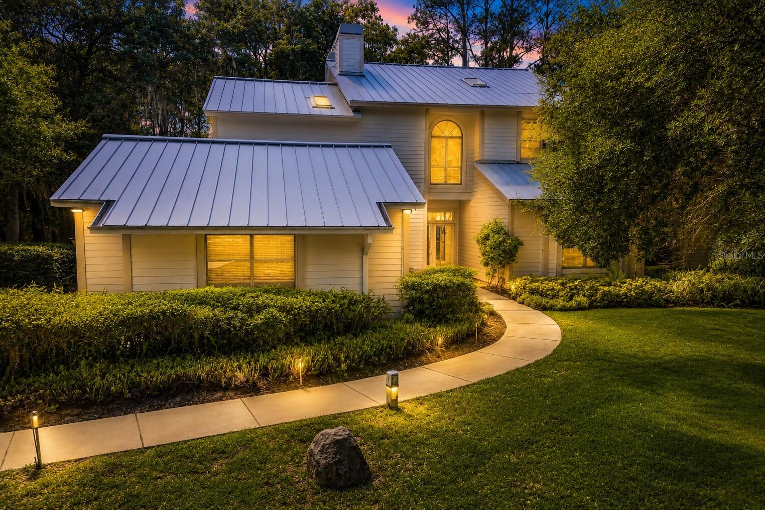 Coastal lake house with metal roof
