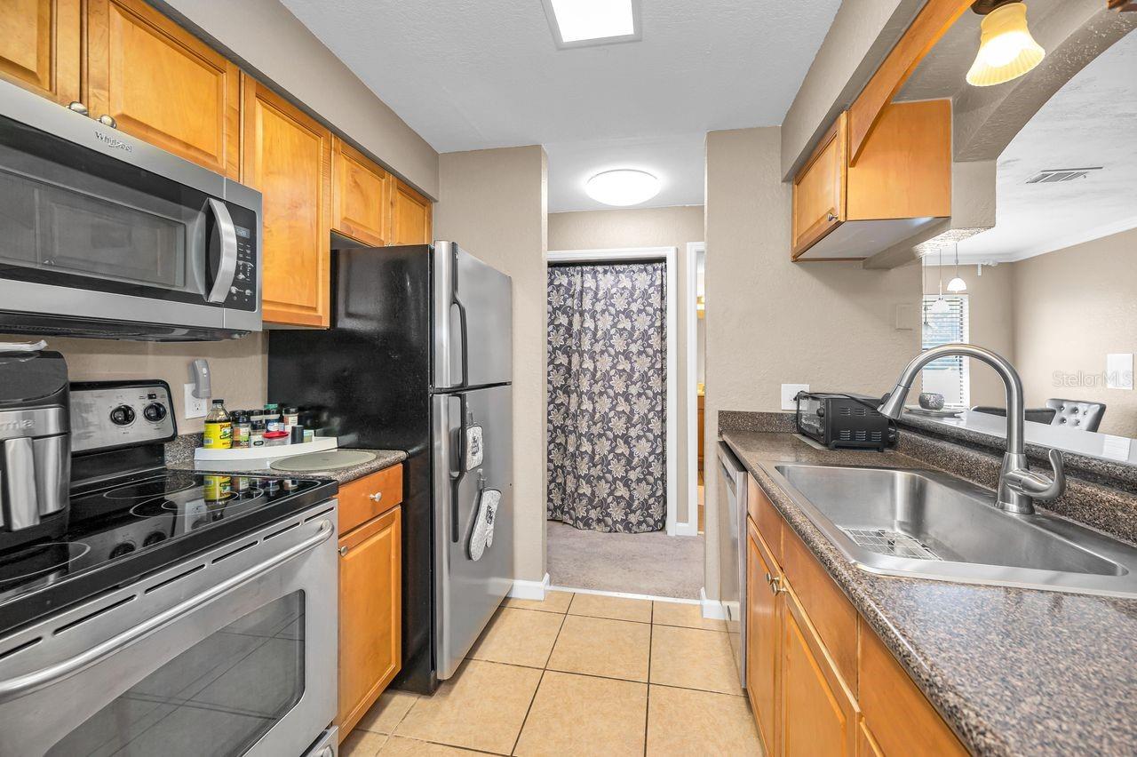 Kitchens offers passthrough to living area with view of the outdoors