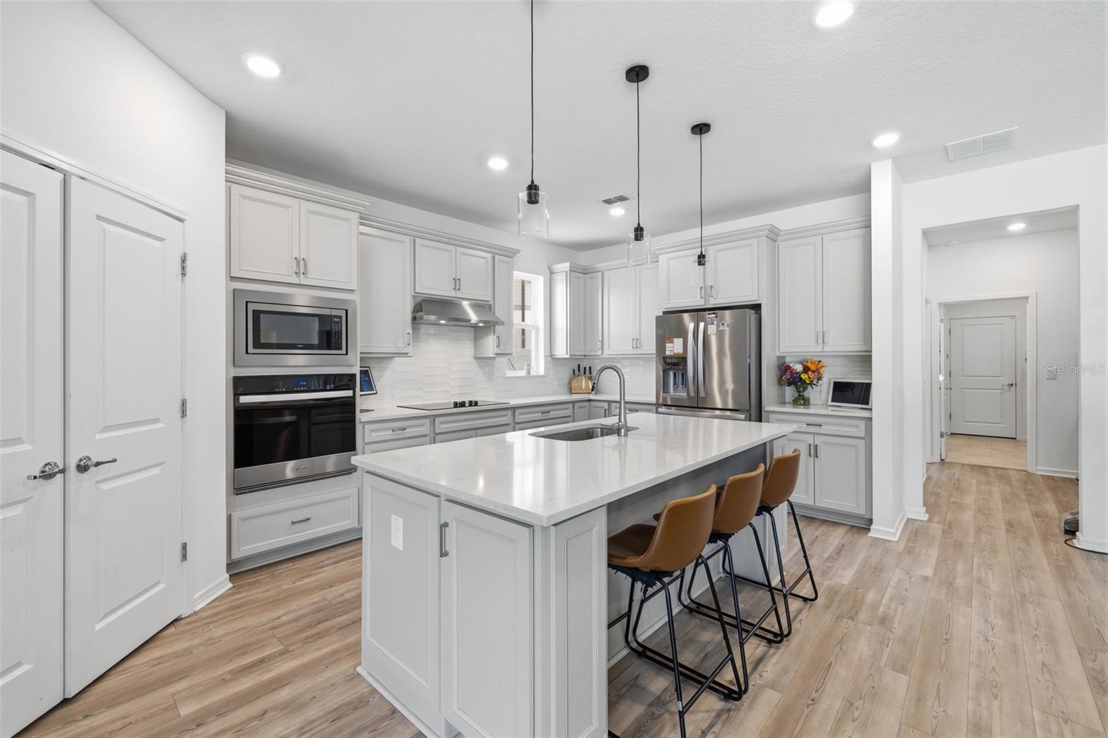 Kitchen with Quartz countertops, ss appliances