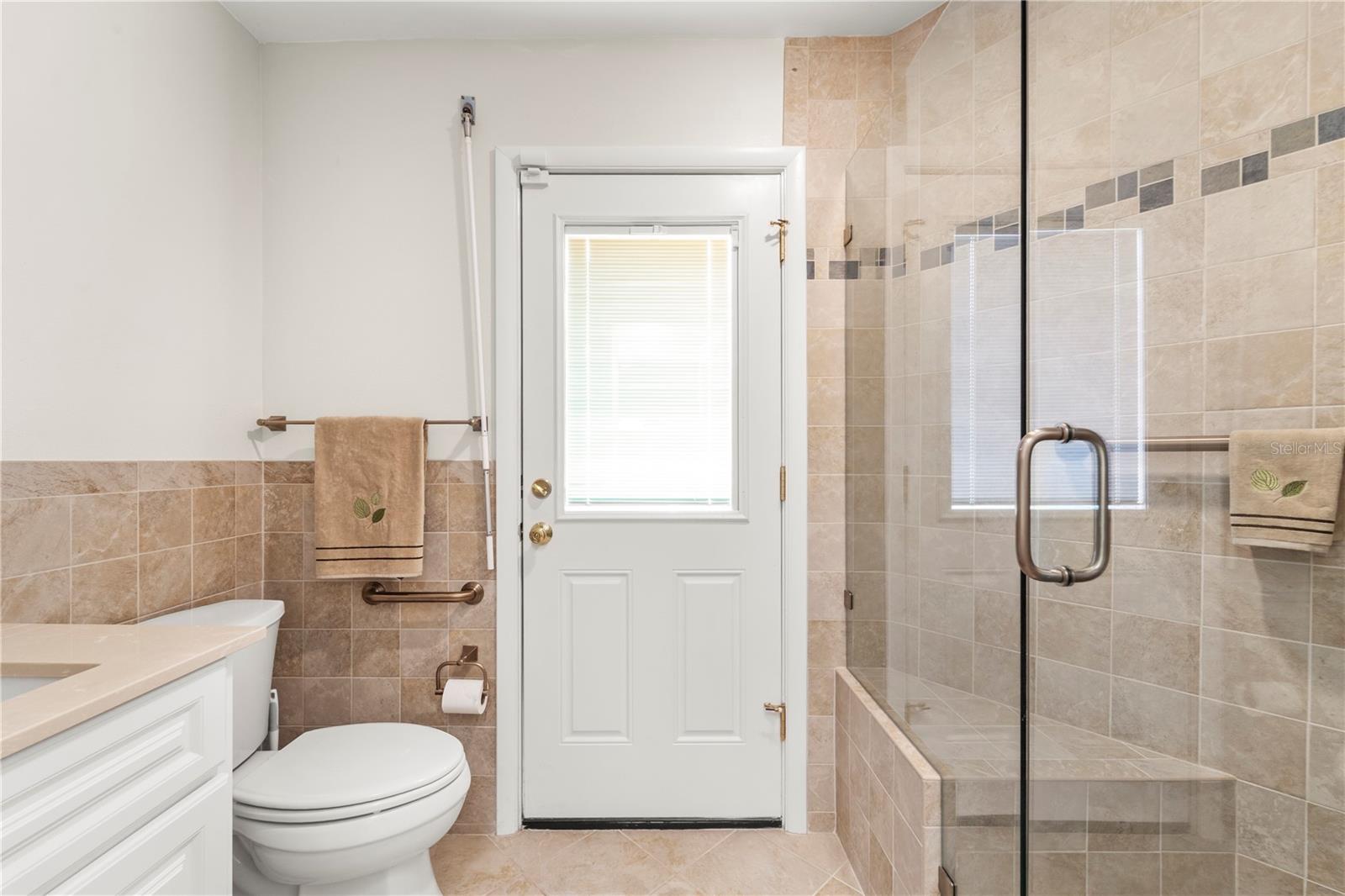 Guest and/or Primary bath with entrance to backyard
