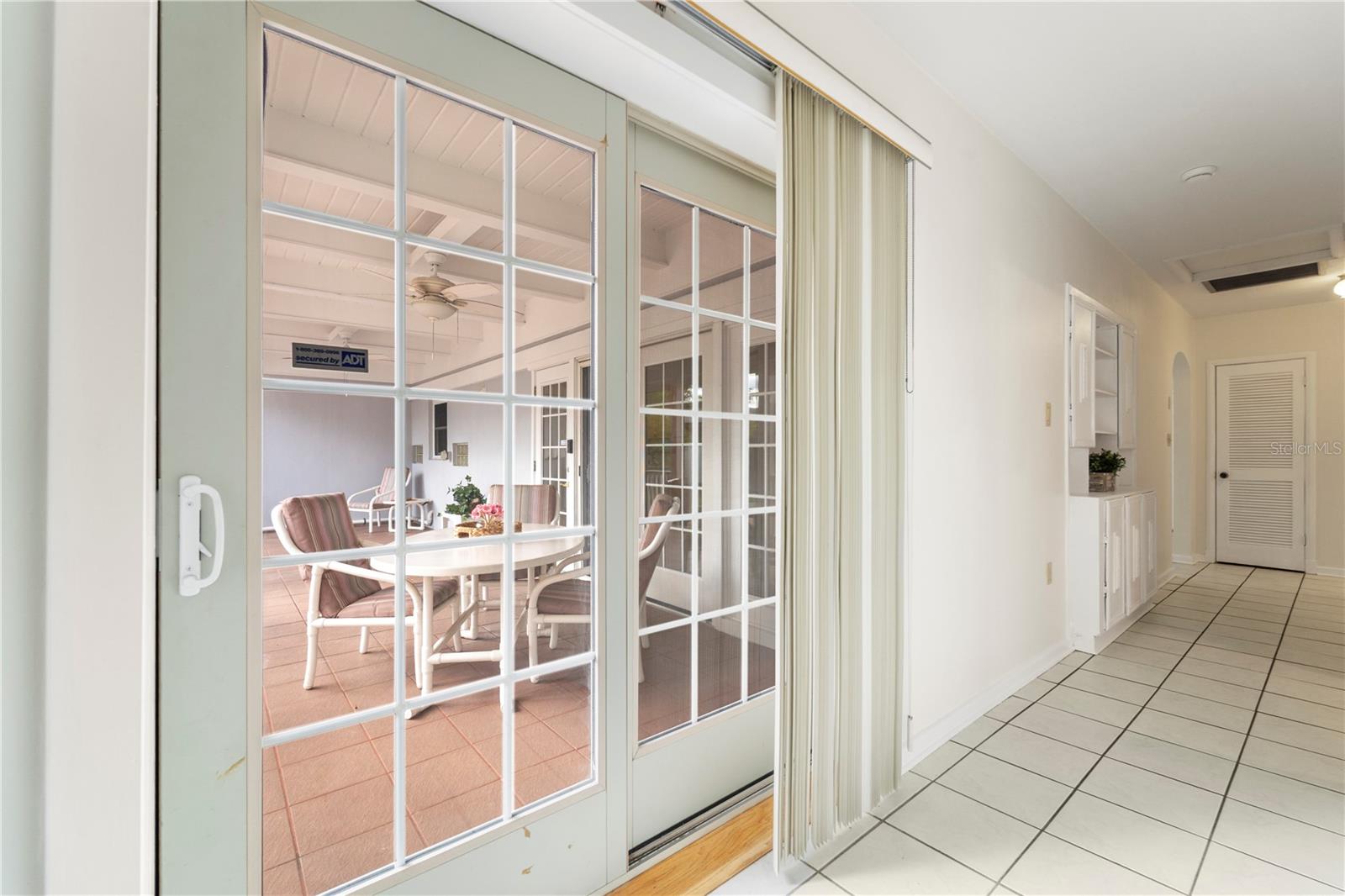 Doors off of dining room to back porch