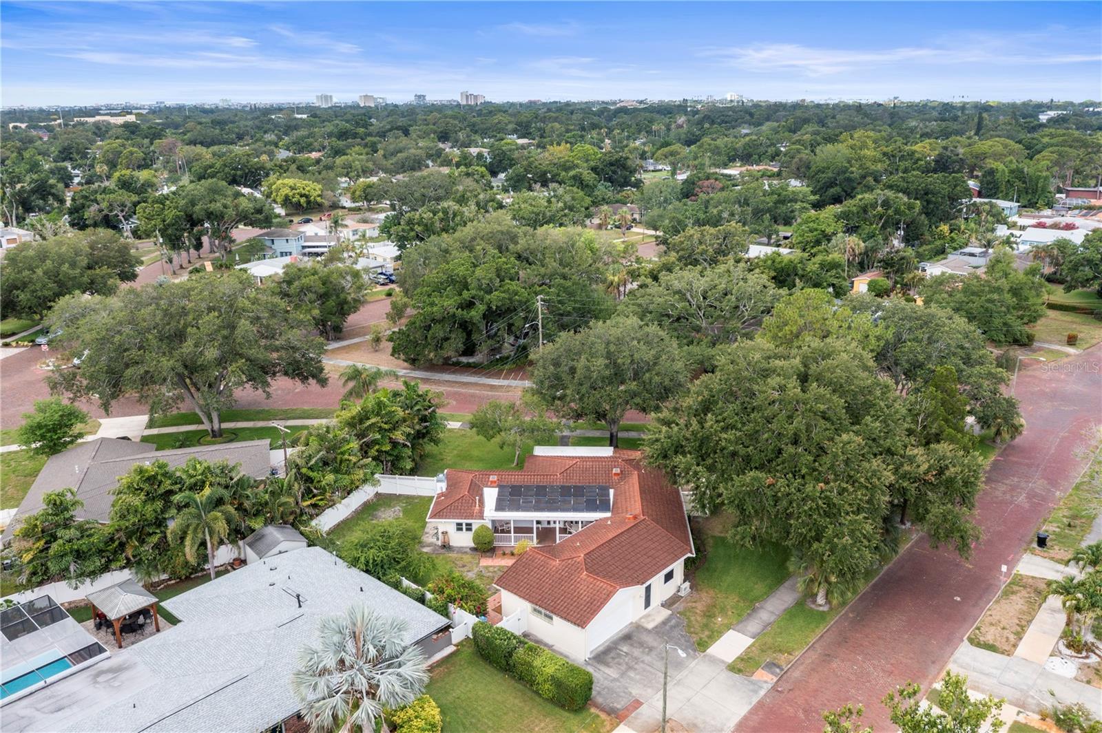 Neighborhood lined with sidewalks and brick roads