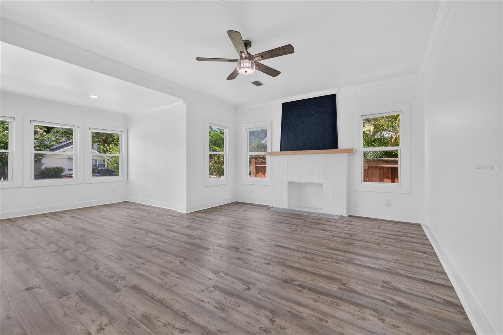 Muted Multi-Tonal Luxury Vinyl Plank Flooring Throughout
