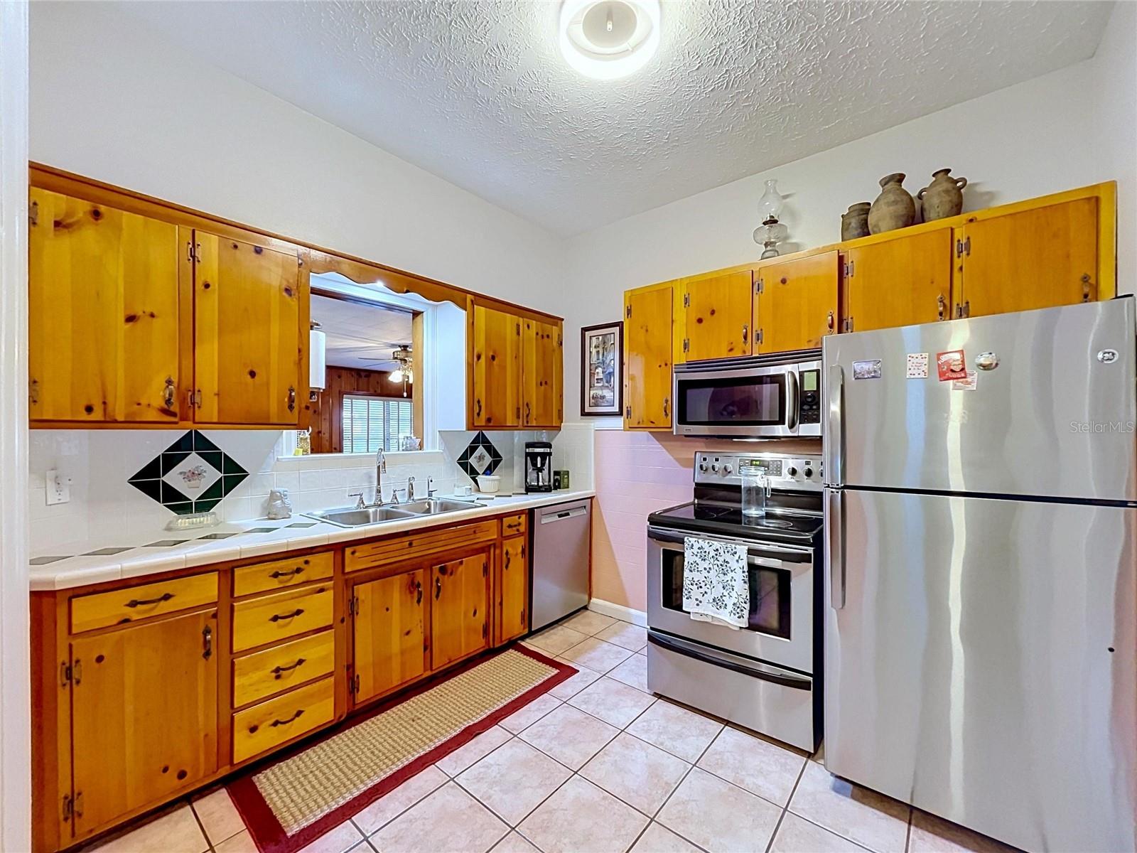 Kitchen with pass-thru window to family room