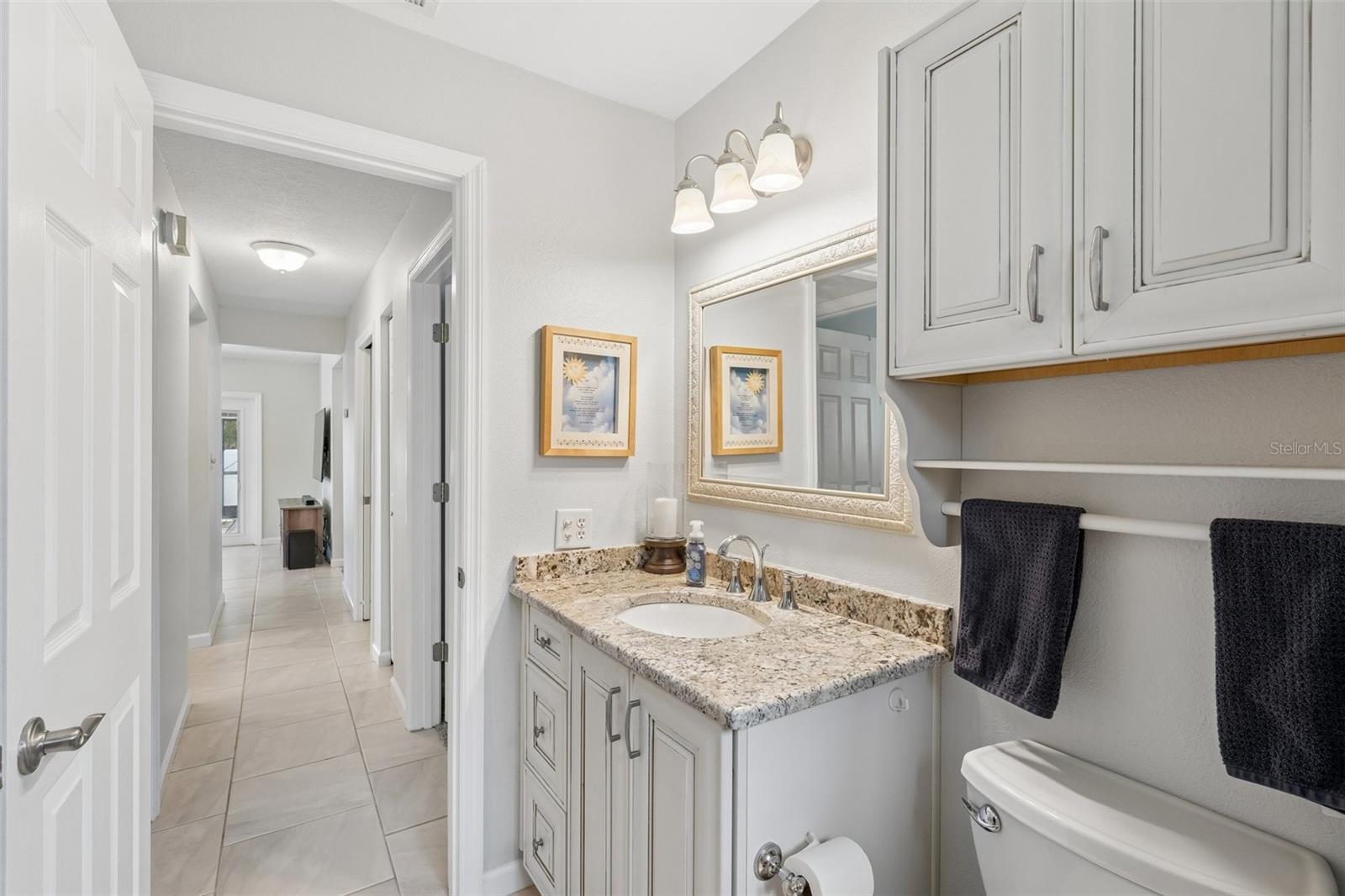 Beautifully appointed second bathroom with tub/shower combination, stylish vanity and ample counterspace.