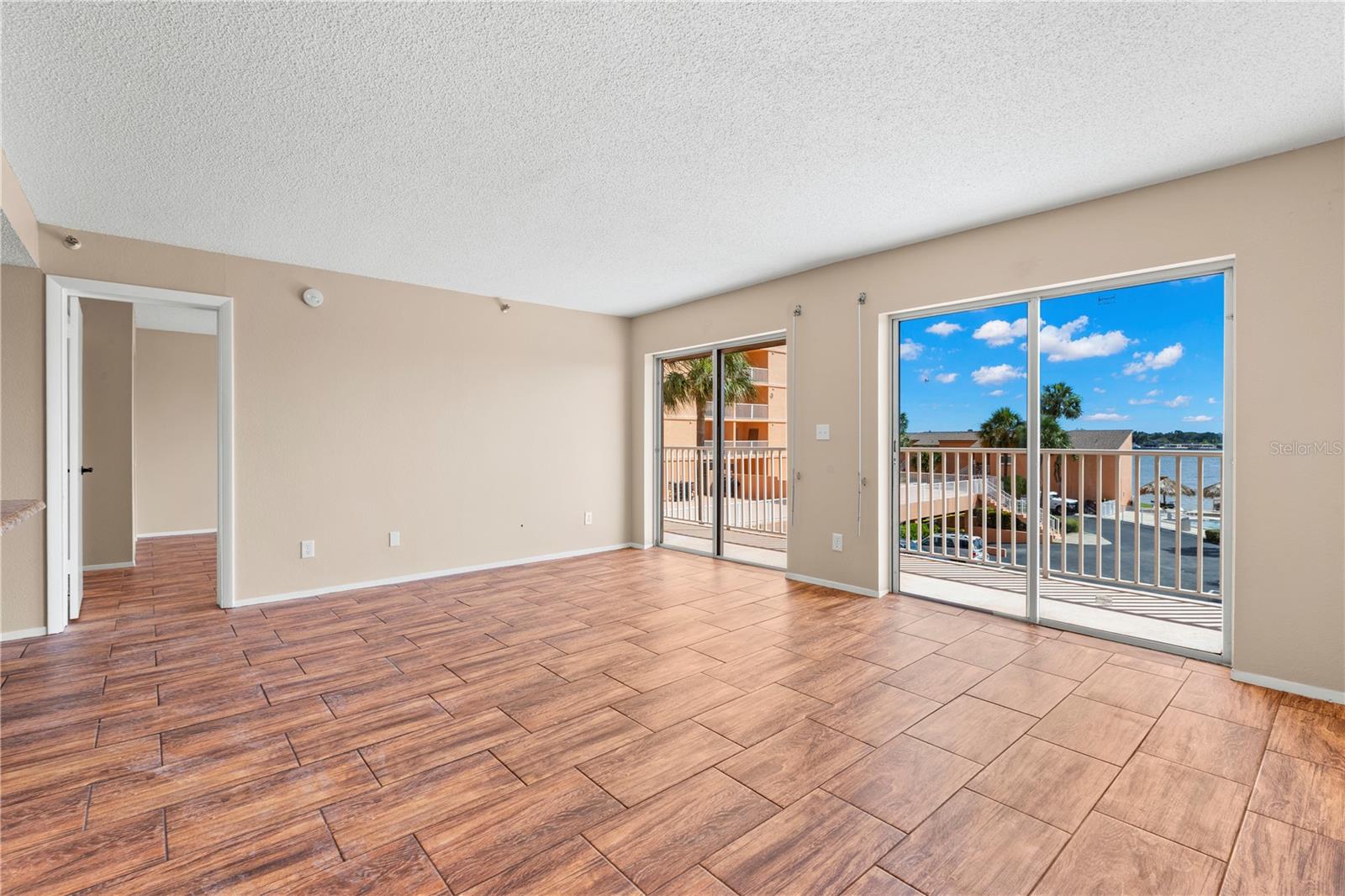 Living Room - 2 sets of sliding glass doors with expansive views.