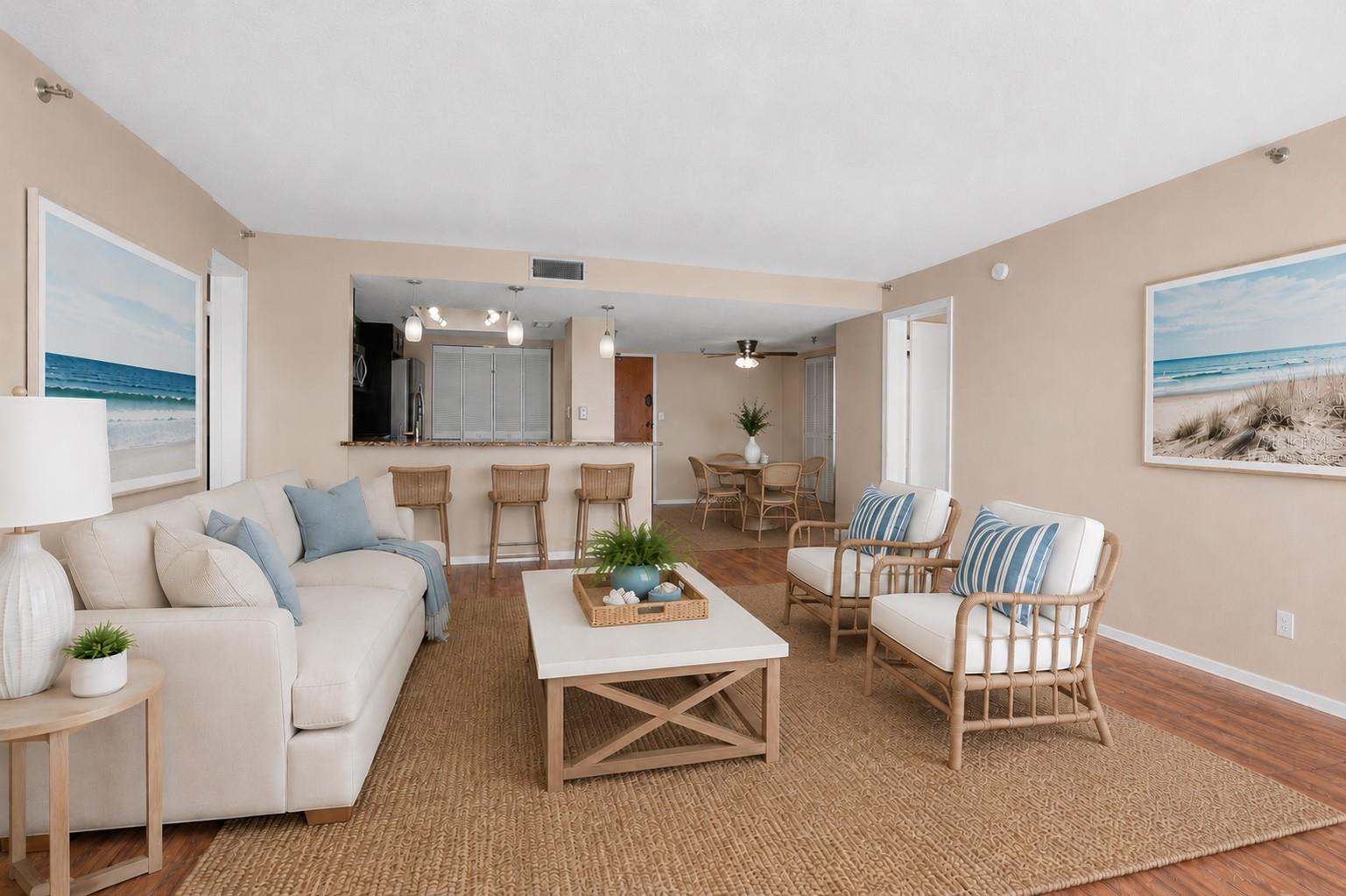 Open and spacious living. Looking into the dining and kitchen.... makes entertaining a breeze. Virtually Staged)
