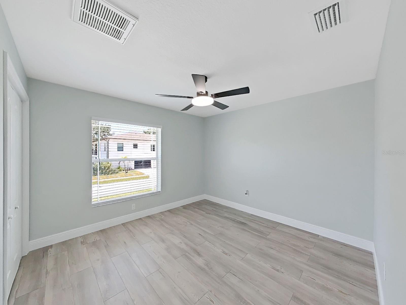 Guest Bedroom 1 with nice high ceilings, new flooring and 6 inch baseboards