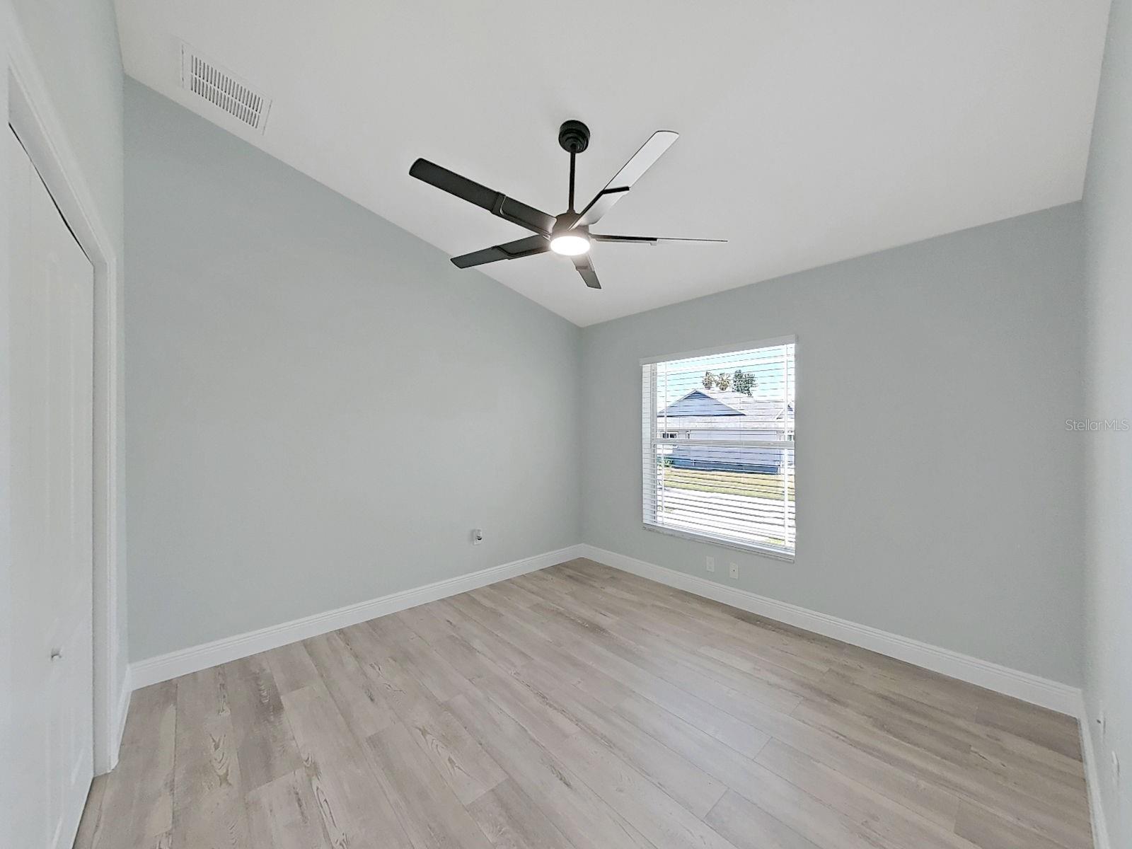 Guest bedroom 2  with nice high ceilings, new flooring and 6 inch baseboards