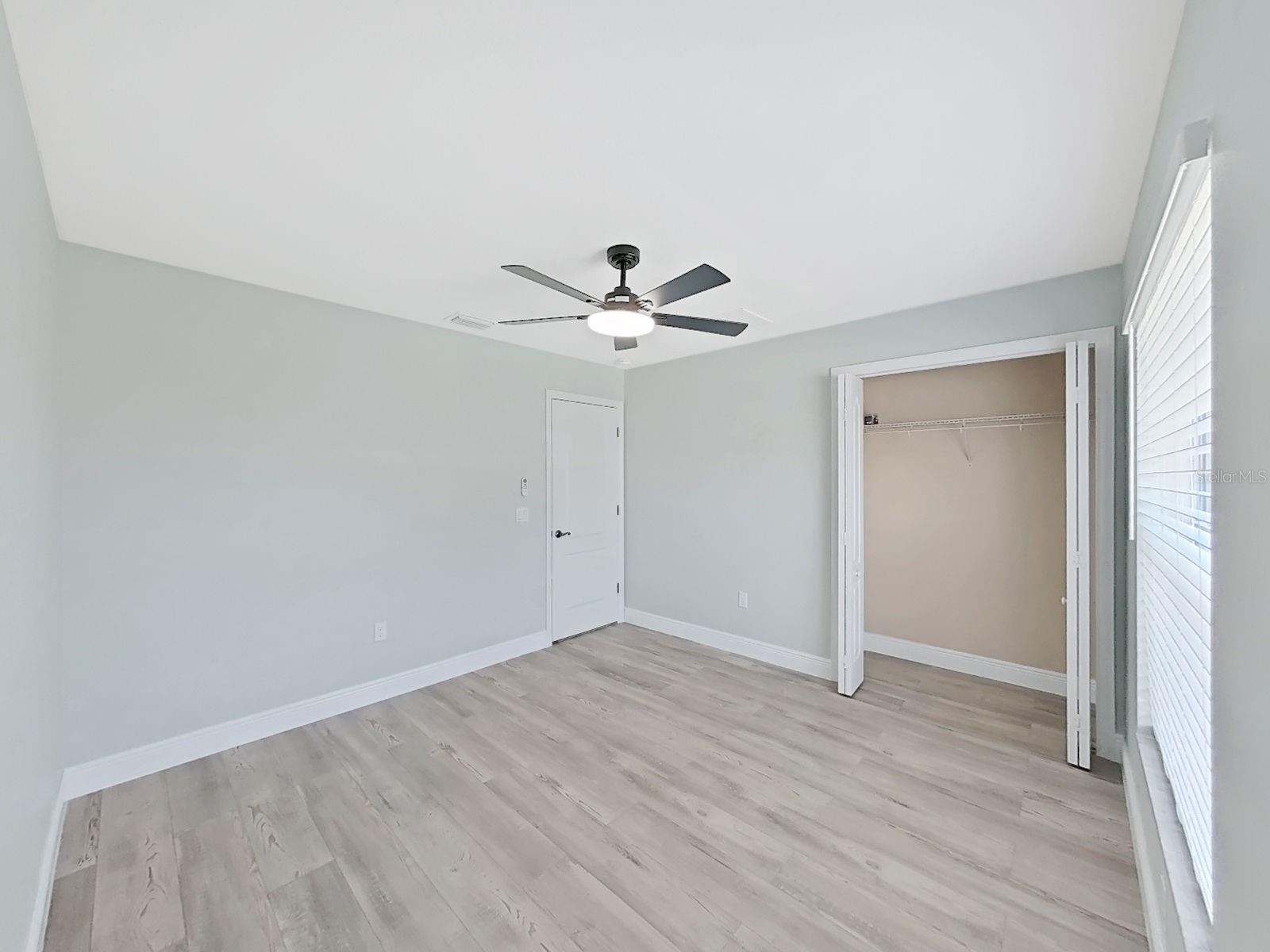 Guest bedroom 2  with nice high ceilings, new flooring and 6 inch baseboards